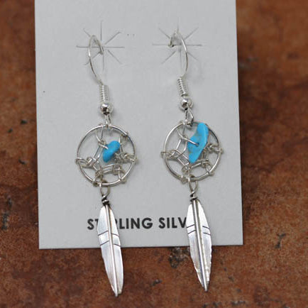 Beautiful Navajo sterling silver dream catcher earrings. The earrings are about 2" in length including the hook and 1/2" wide at the widest point.