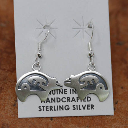 Beautiful Native American bear shaped earrings. They are made from sterling silver. The earrings are about 1 3/4" in length including the hook, and 1" in width. It is stamped Sterling and SG.