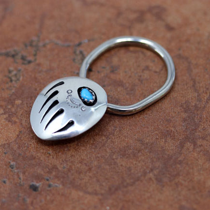A very nice Navajo Native American key chain by Ervin Begay. It is made from sterling silver and turquoise. The key chain is about 1 7/8" in length and 3/4".