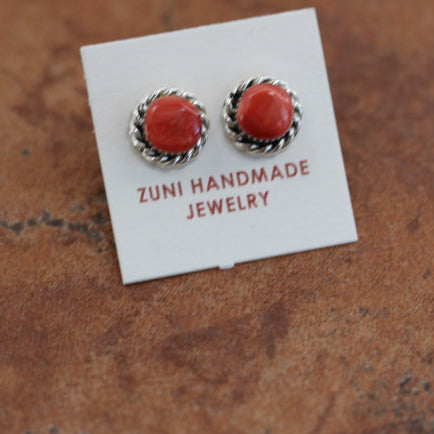 Circular stud earrings with a red spiny oyster gemstone