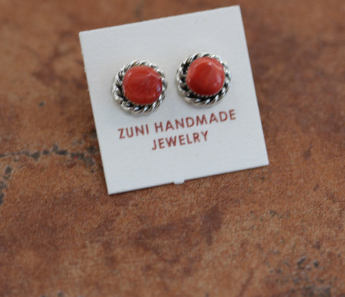 Circular stud earrings with a red spiny oyster gemstone