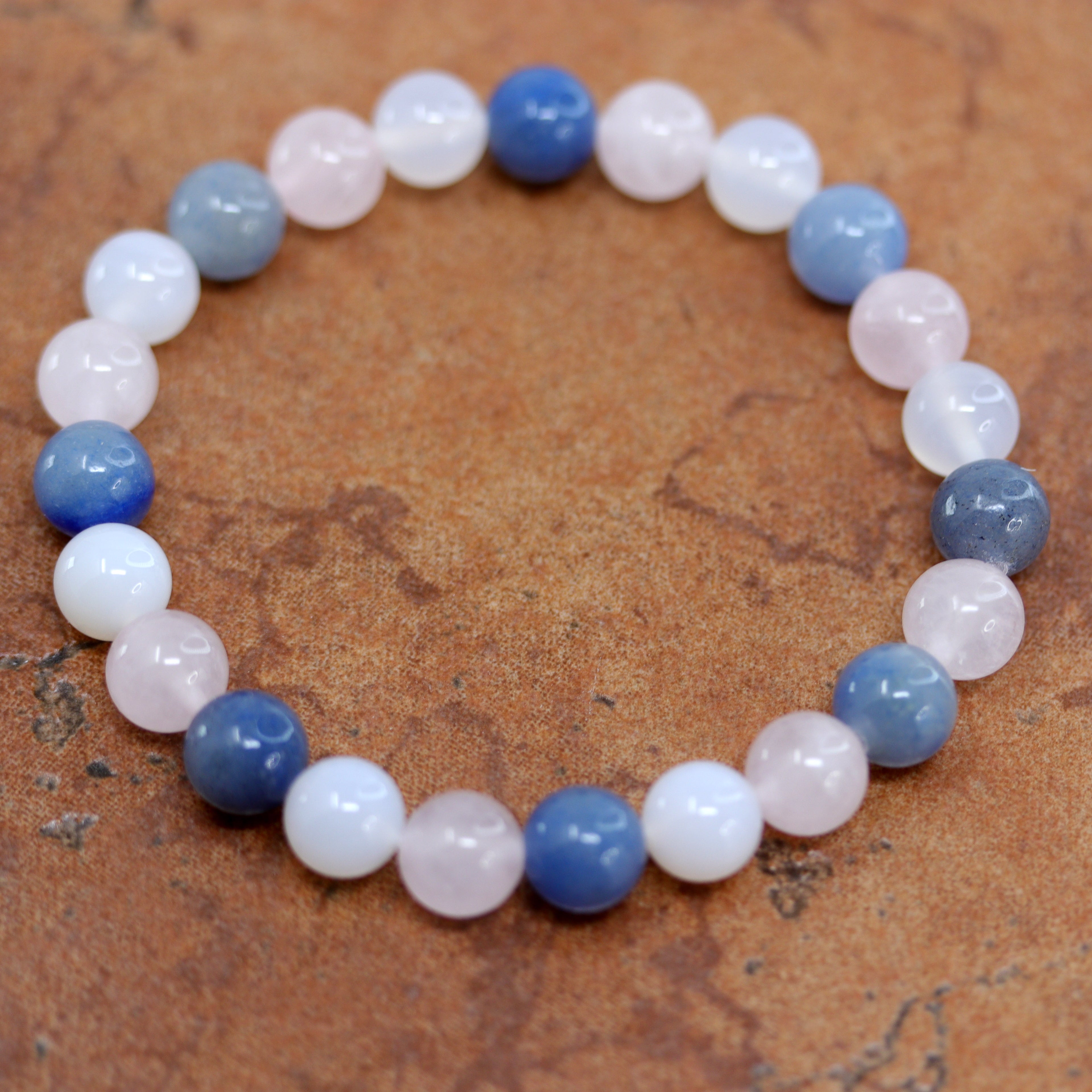 A beautiful bubble bracelet with gemstones. The stones include rose quartz and agate. It fits sizes 6" (more loose) to about 9" (tighter fit). The width of the bracelet is 8 mm.