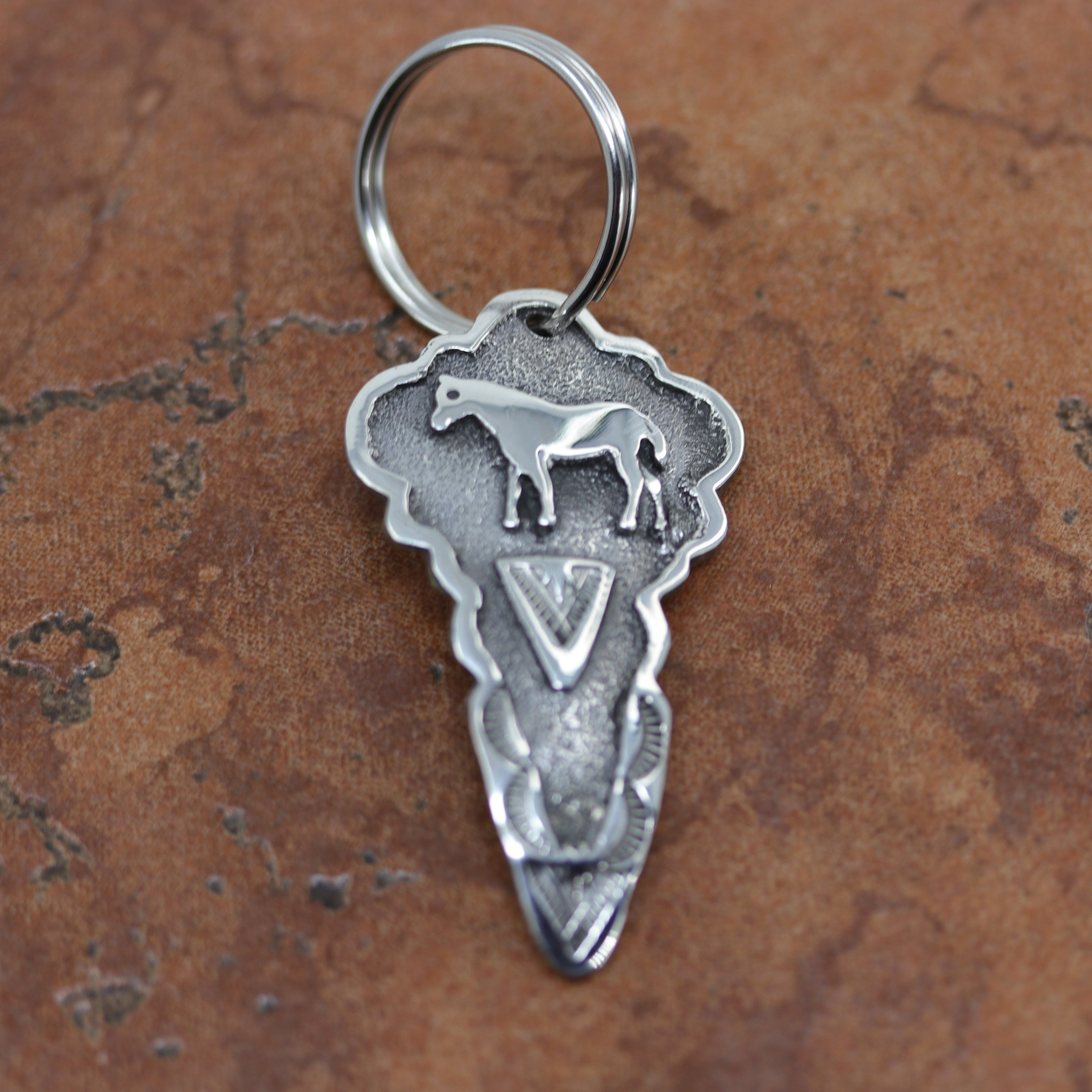 Beautiful Navajo Native American horse key chain. It is made from sterling silver. The key chain is about 3" in length and 1 1/4".