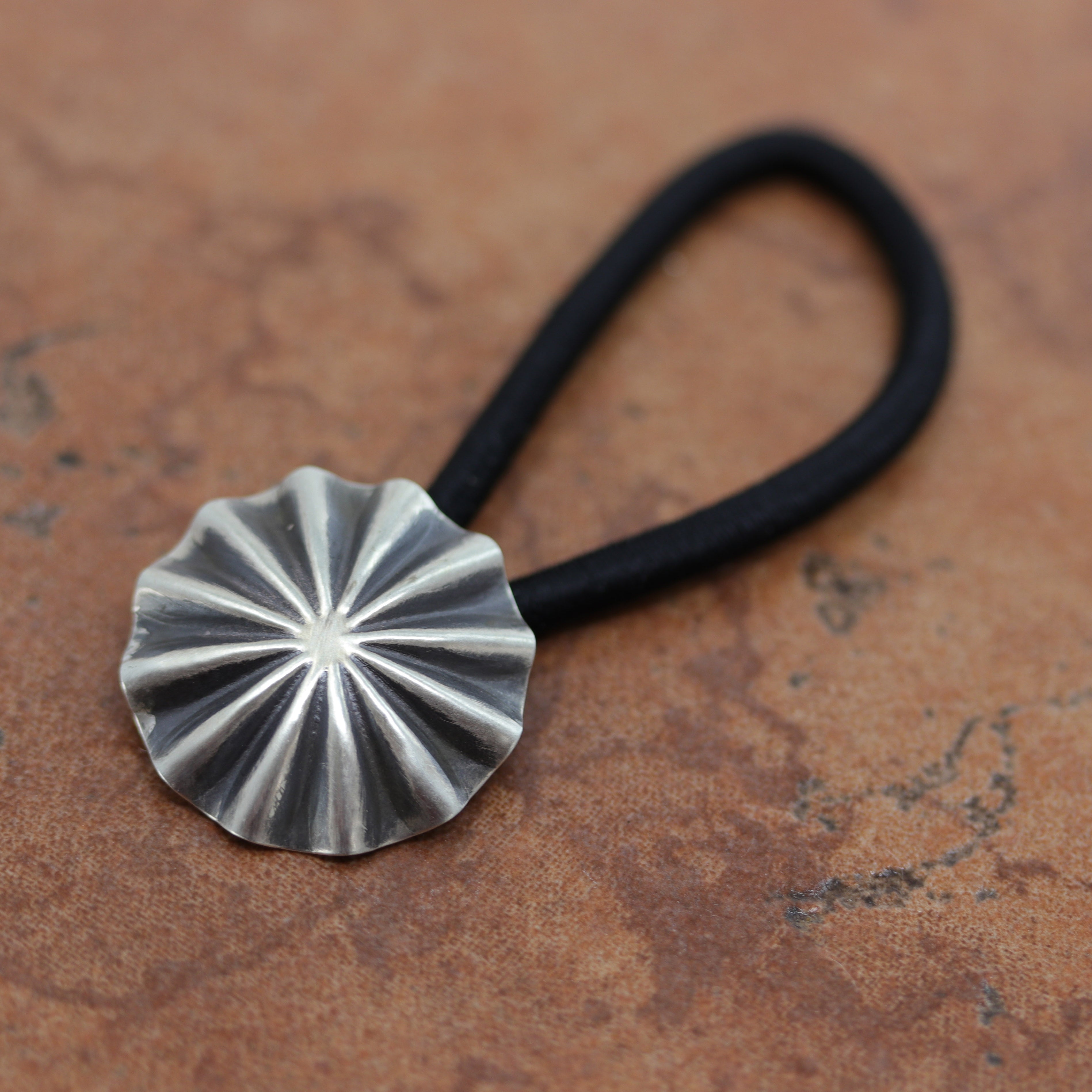 Gorgeous Navajo Native American hair tie made from a hair band and sterling silver. It is 2 3/4" long, and about 1" in diameter