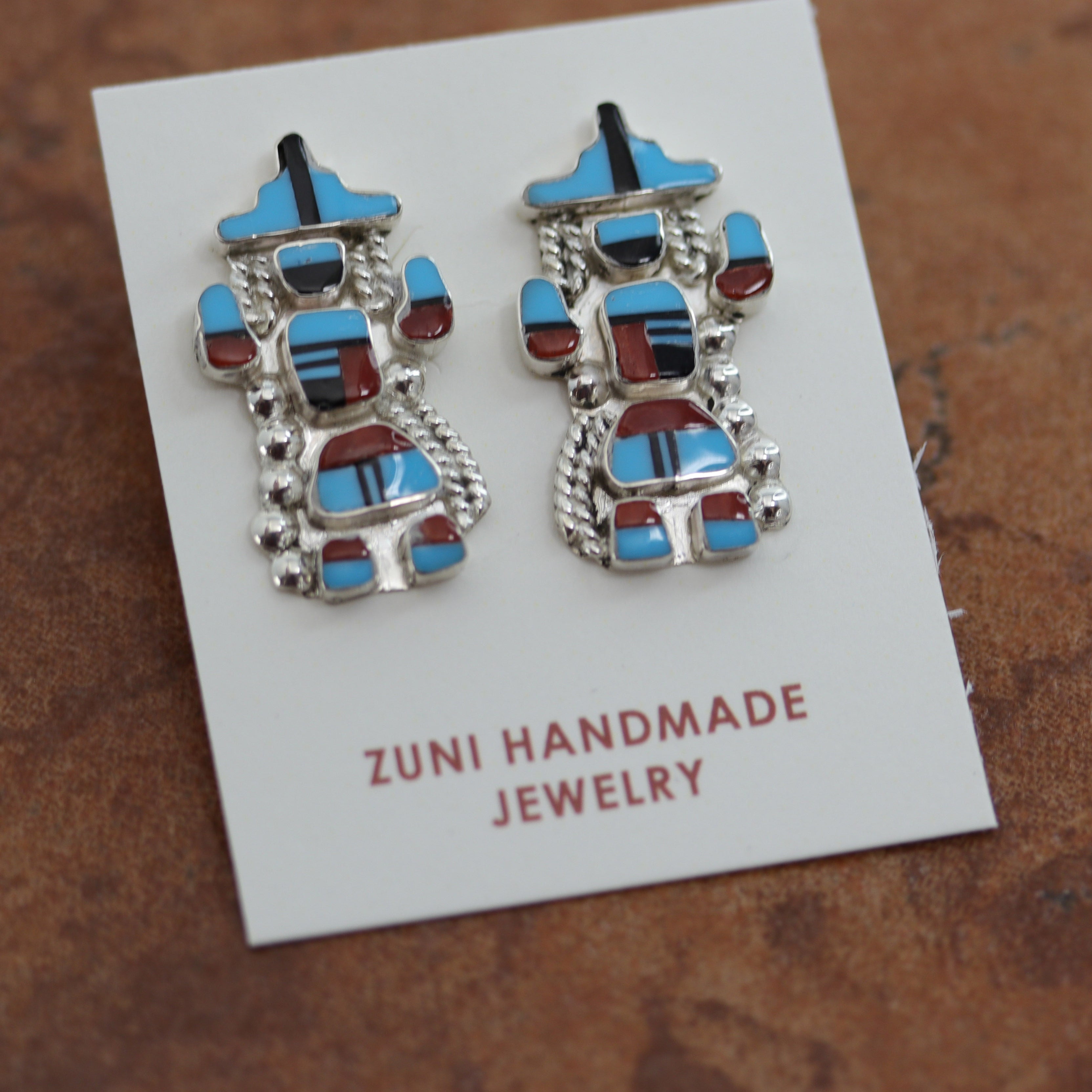 Beautiful Zuni Native American earrings. They are made from sterling silver and multi-stone inlay. Each earring is 1 1/8" in length, and about 5/8" in width.
