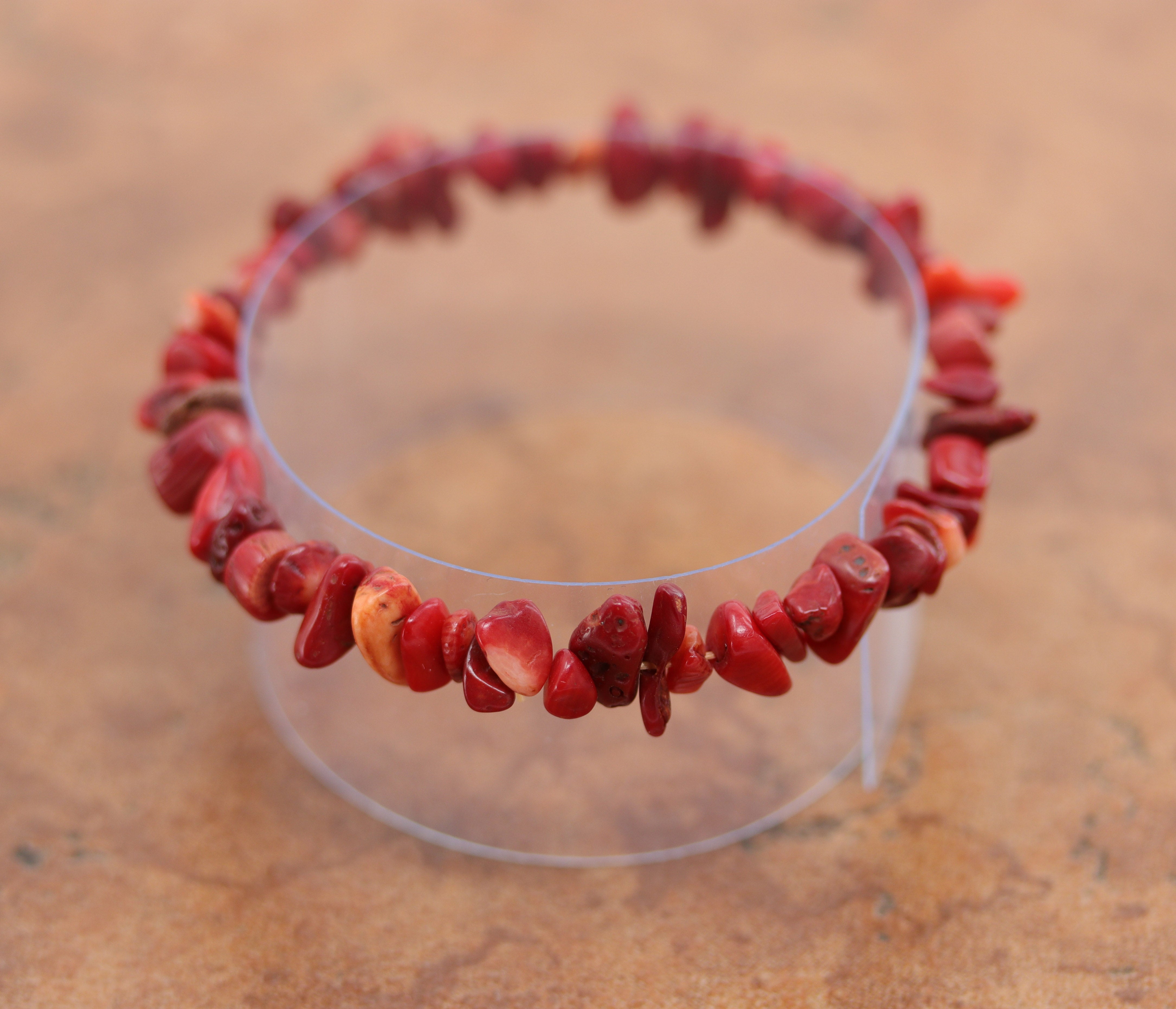 Unique bamboo coral chip bracelet that fits sizes 6" (more loose) to about 9" (tighter fit). The width of the bracelet is 1/2".