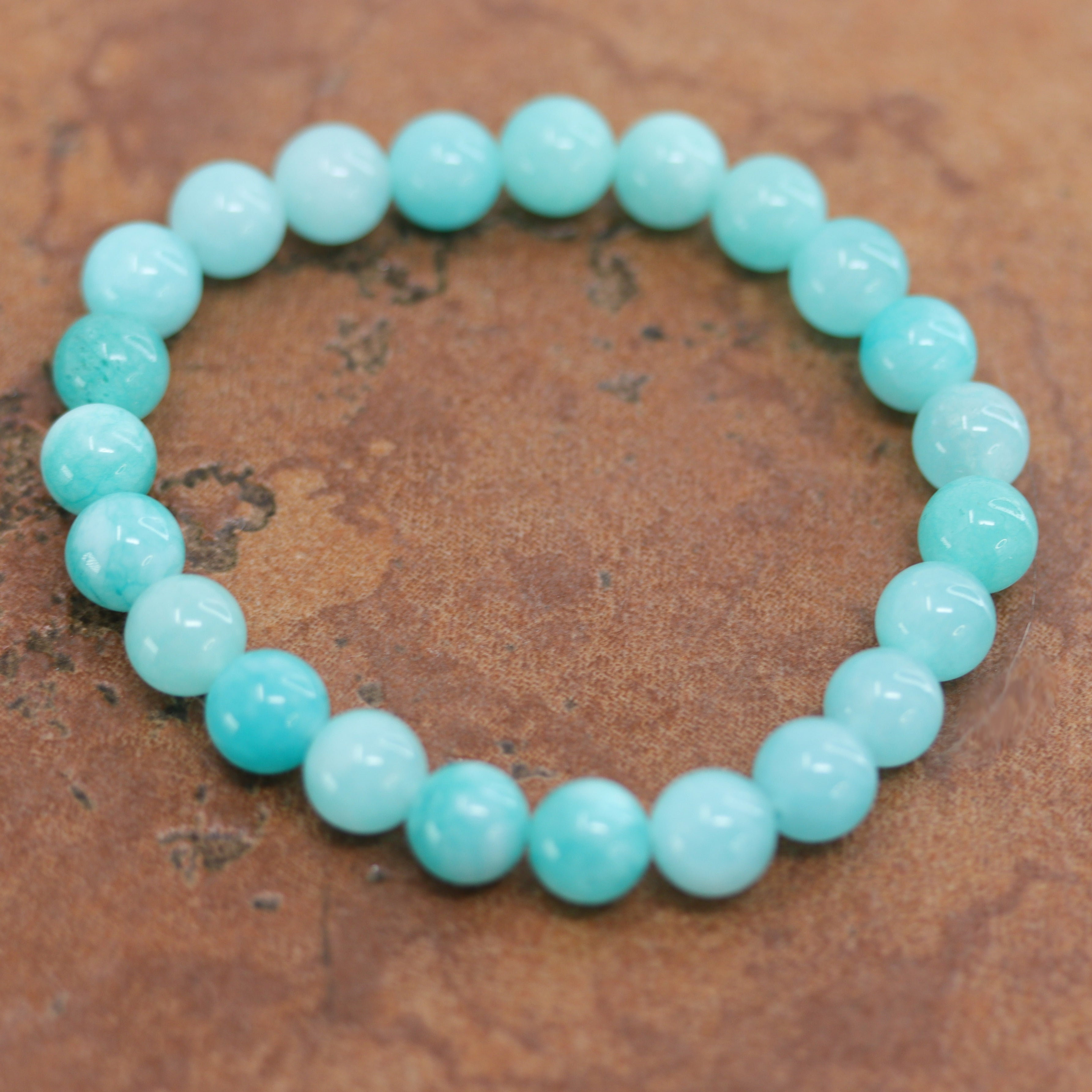 It fits sizes 6" (more loose) to about 9" (tighter fit). The width of the bracelet is 8 mm.