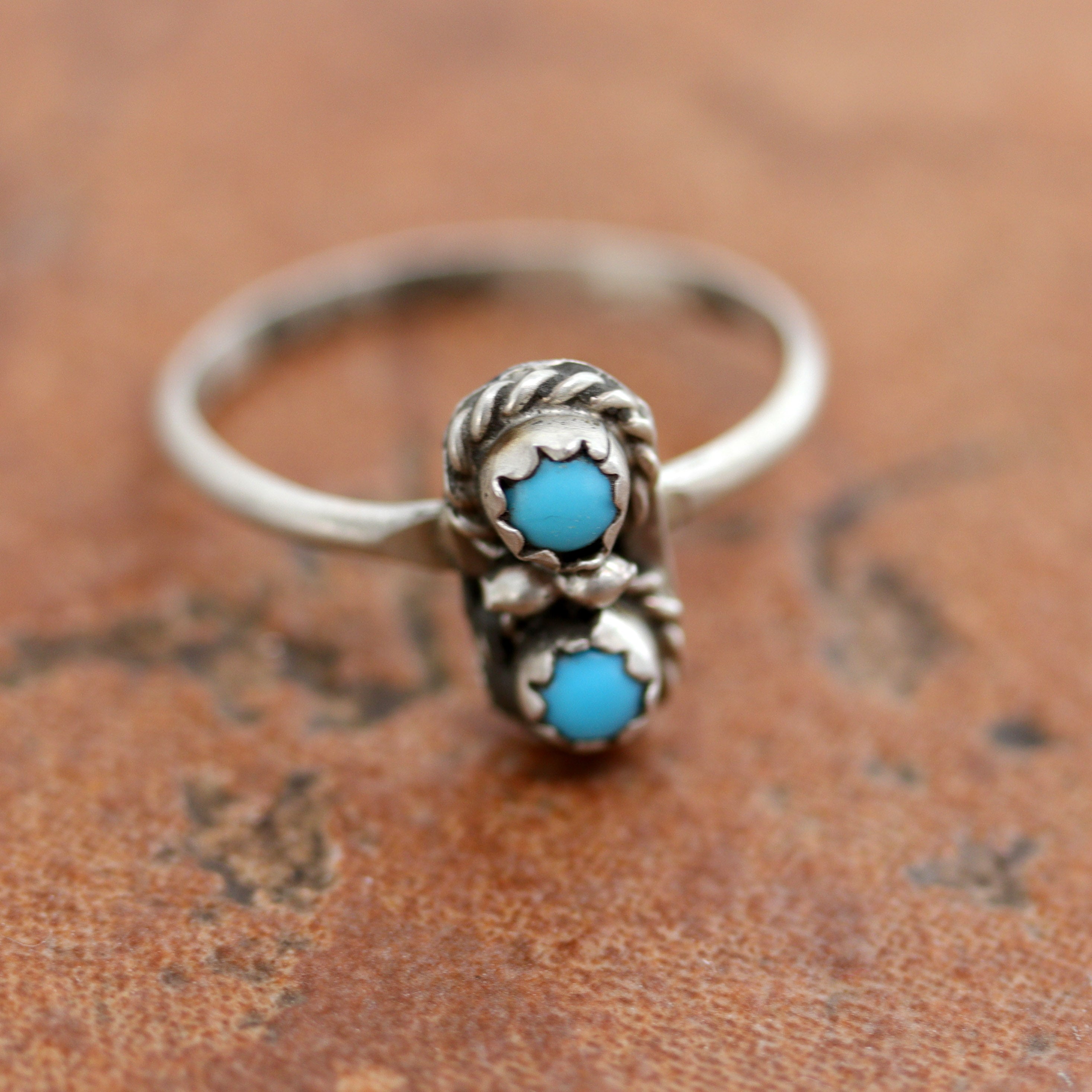Beautiful Navajo Native American ring. It is made from sterling silver and turquoise. The ring size 7 1/2 and it is 1/2" in length.