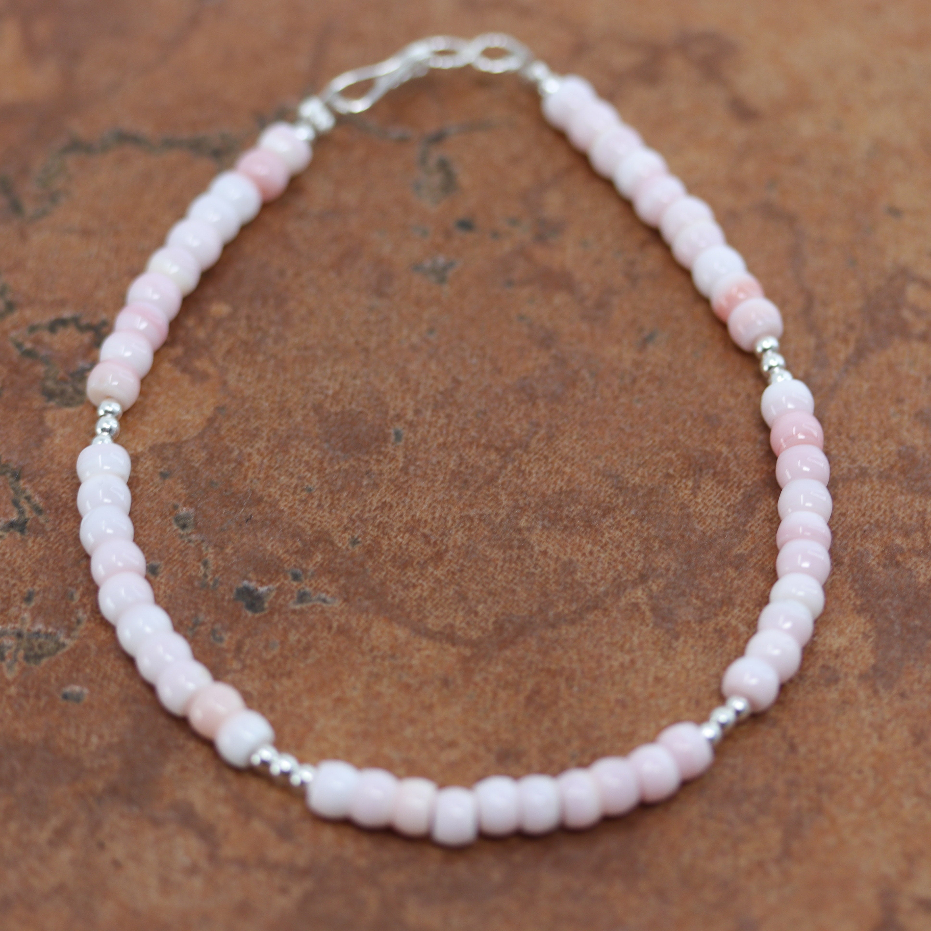A beautiful Navajo Heishi bracelet. It is about 7 3/4" from end to end and 1/4" wide. 
