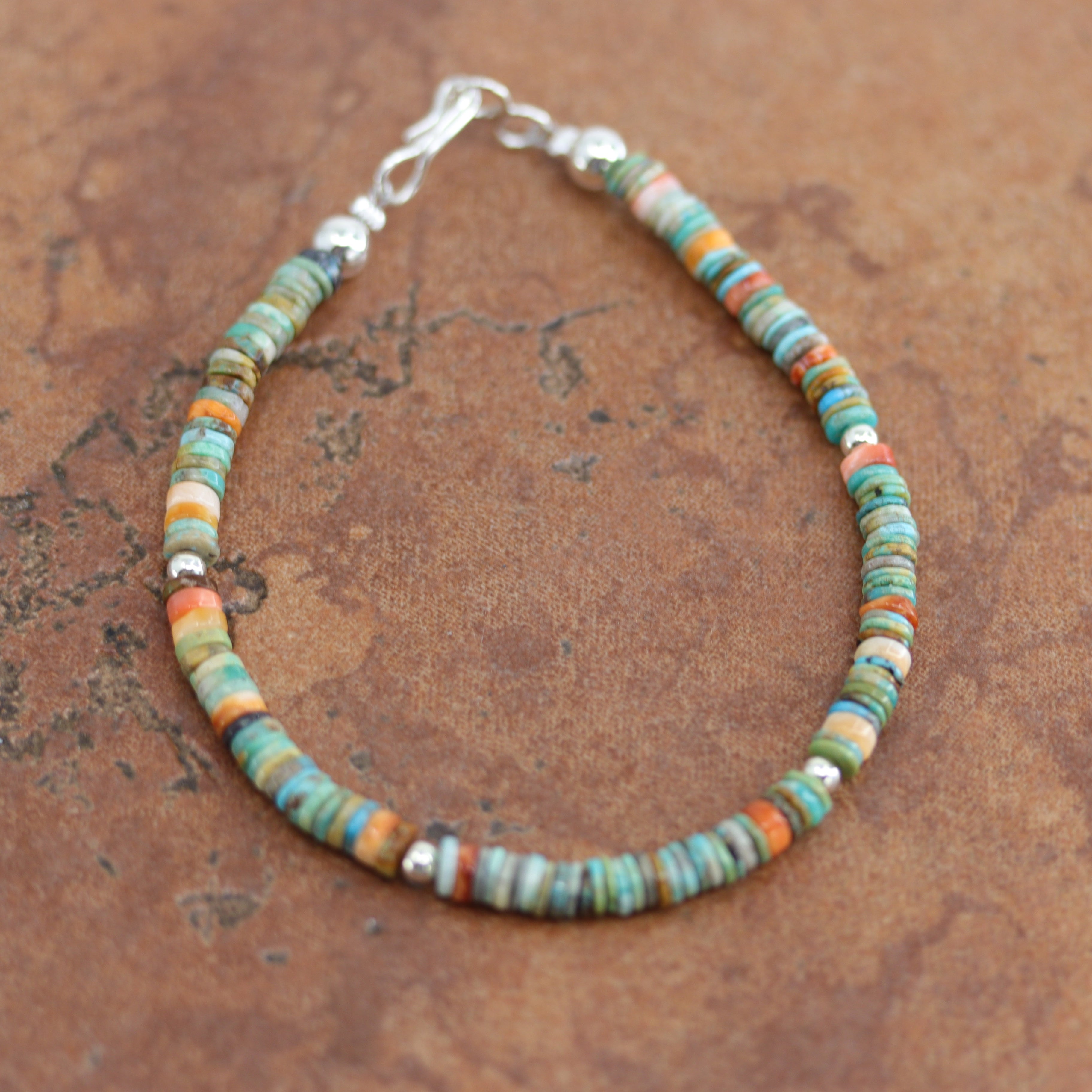 A beautiful Navajo Style bracelet. It is about 7 1/2" from end to end and 3/16" wide. 