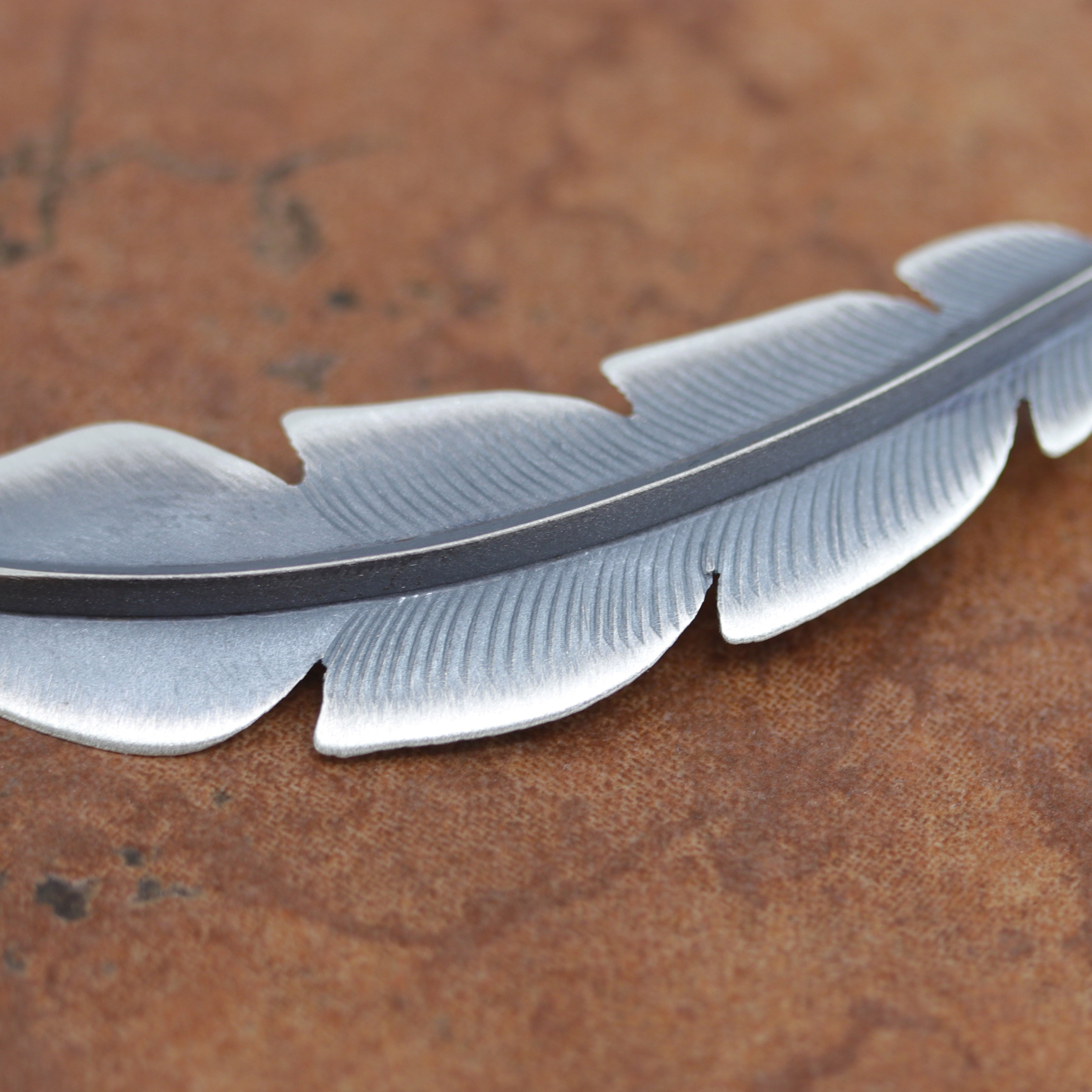 Gorgeous Navajo Native American Feather Pendant made by Chris Charlie. It is made from sterling silver. It is 3 1/8" long and about 3/4" wide.