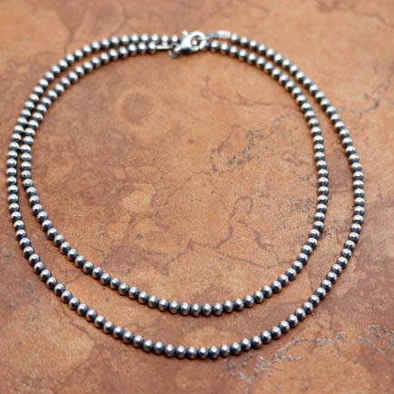 A beautiful silver Navajo Pearl necklace. The necklace is 26" in length and the beads measure 4 mm.