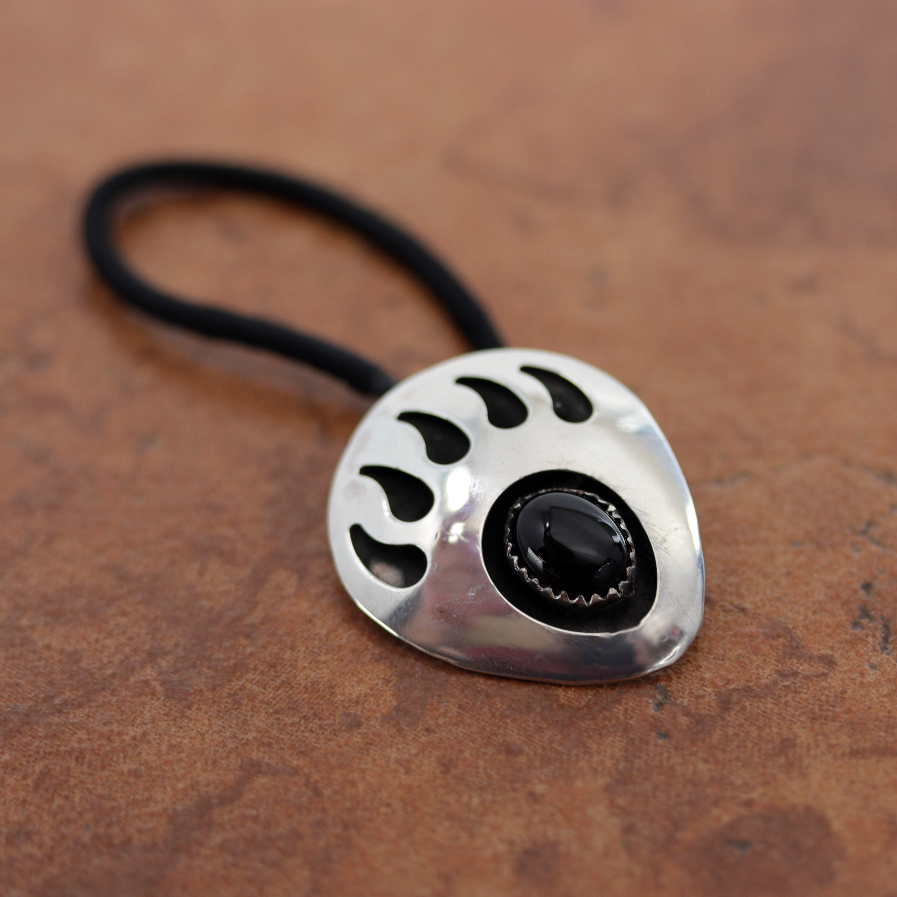 Beautiful Navajo Native American hair tie made from a hair band, sterling silver, and onyx. It is 2 3/4" long (including the hair tie) and 1 1/8" wide.