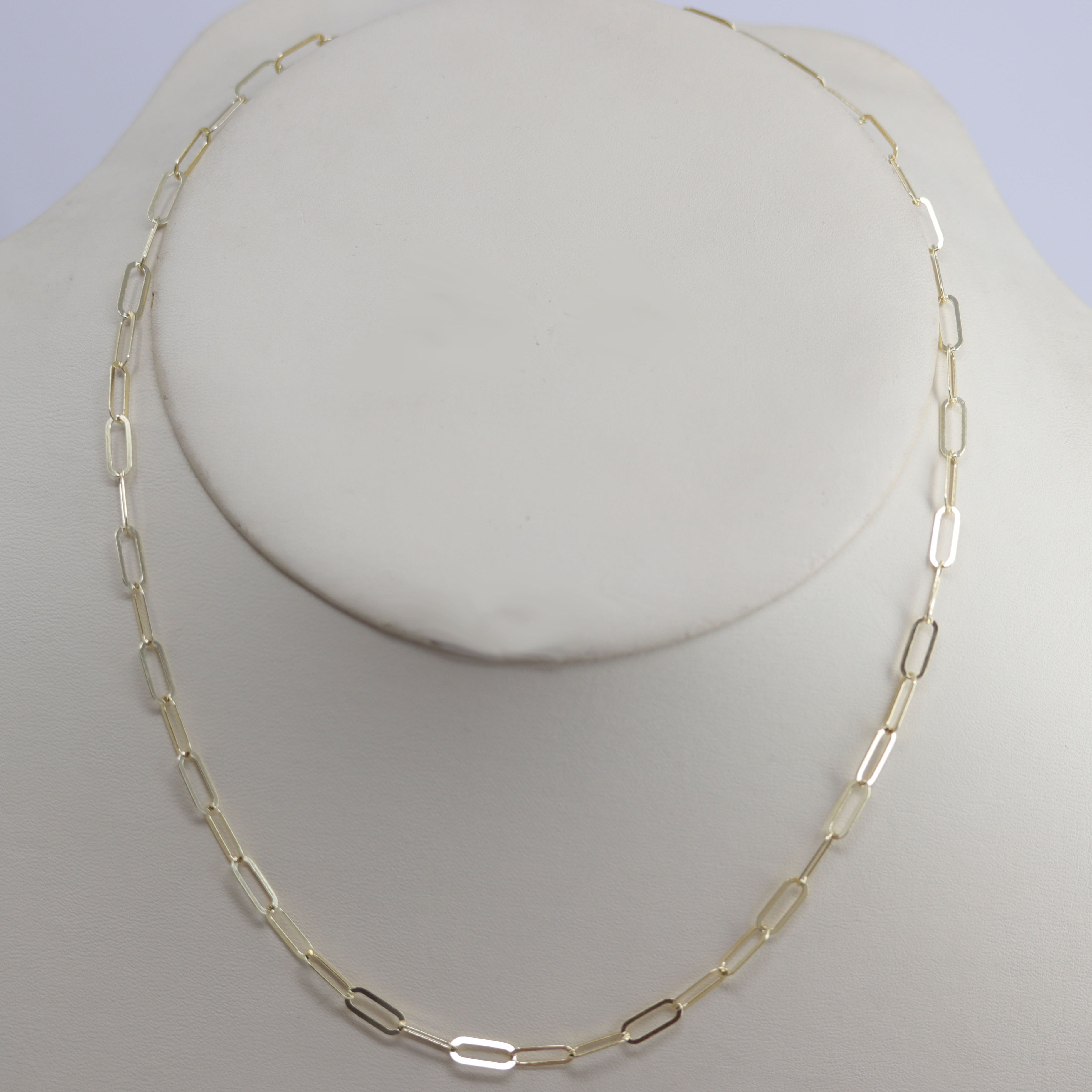 A Beautiful Paper Clip Chain Link Necklace. It is made from .925 sterling silver and gold overlay. The length is about 18" and the width is 3/16".