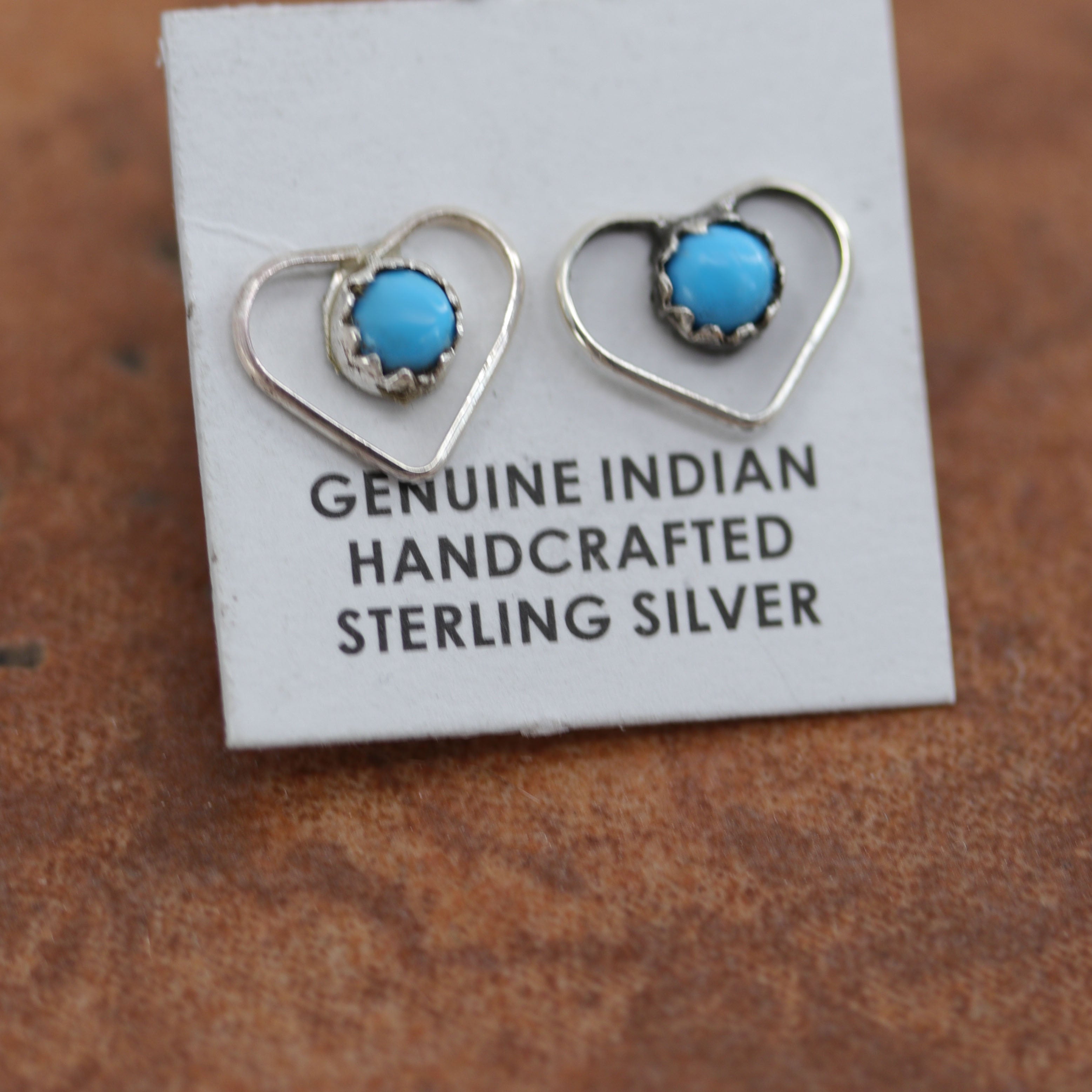 Beautiful Zuni Native American twist wire earrings. They are made from sterling silver and turquoise. Each earring is 3/8" in length, and about 3/8" in width.