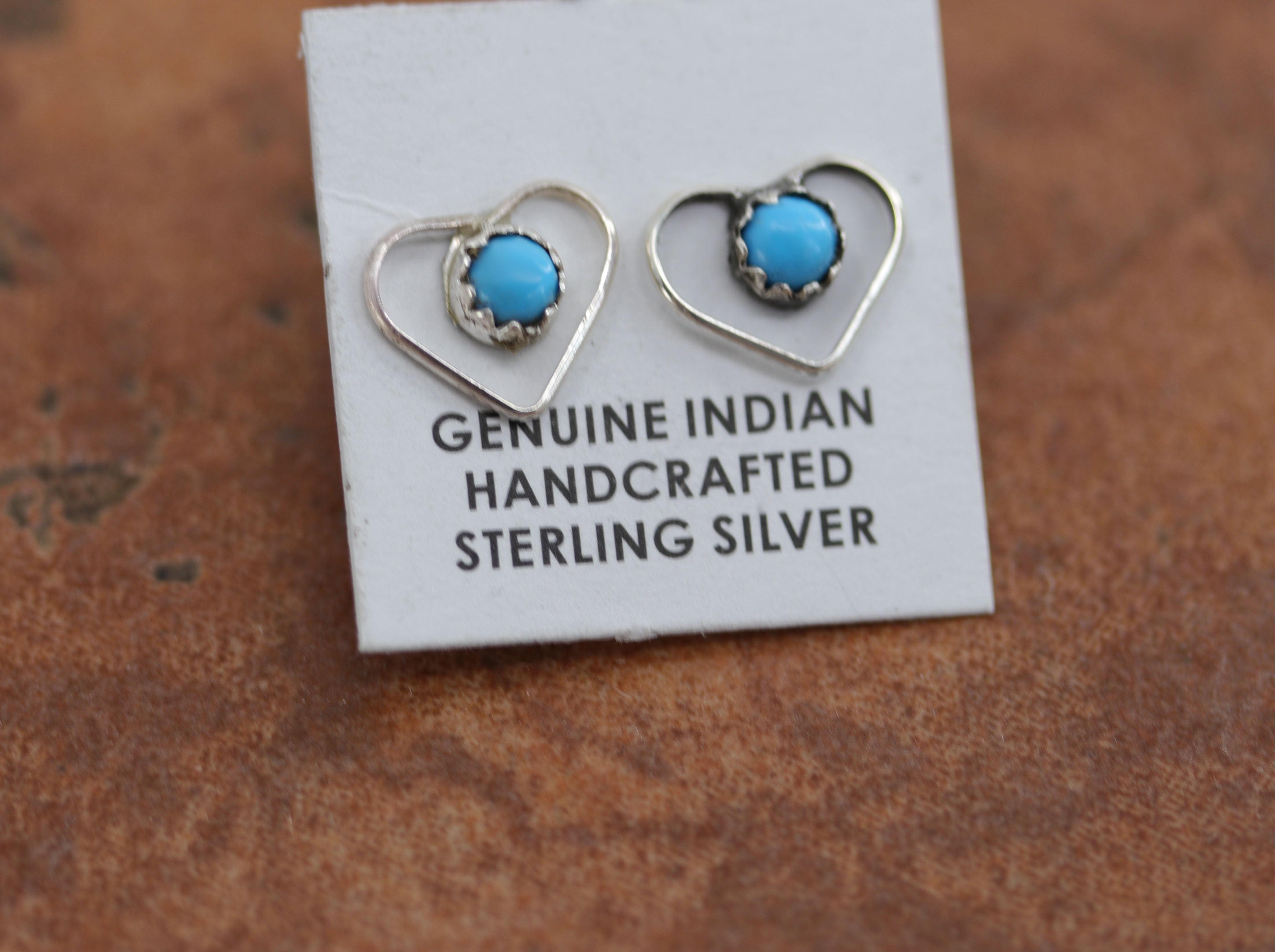 Beautiful Zuni Native American twist wire earrings. They are made from sterling silver and turquoise. Each earring is 3/8" in length, and about 3/8" in width.