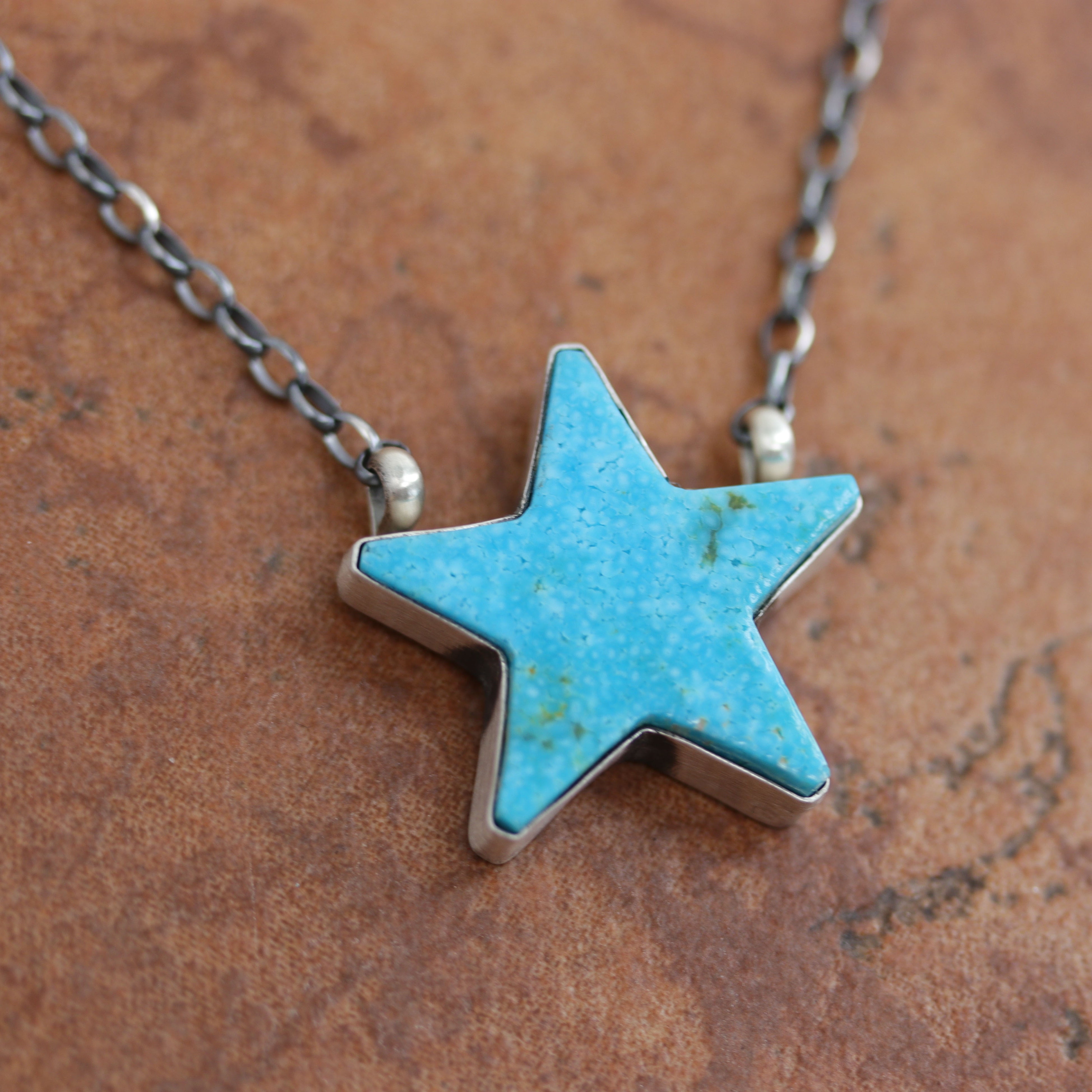 A beautiful Navajo Native American necklace. It is made from sterling silver and turquoise. The necklace is about 16" in length. The pendant measures 1".