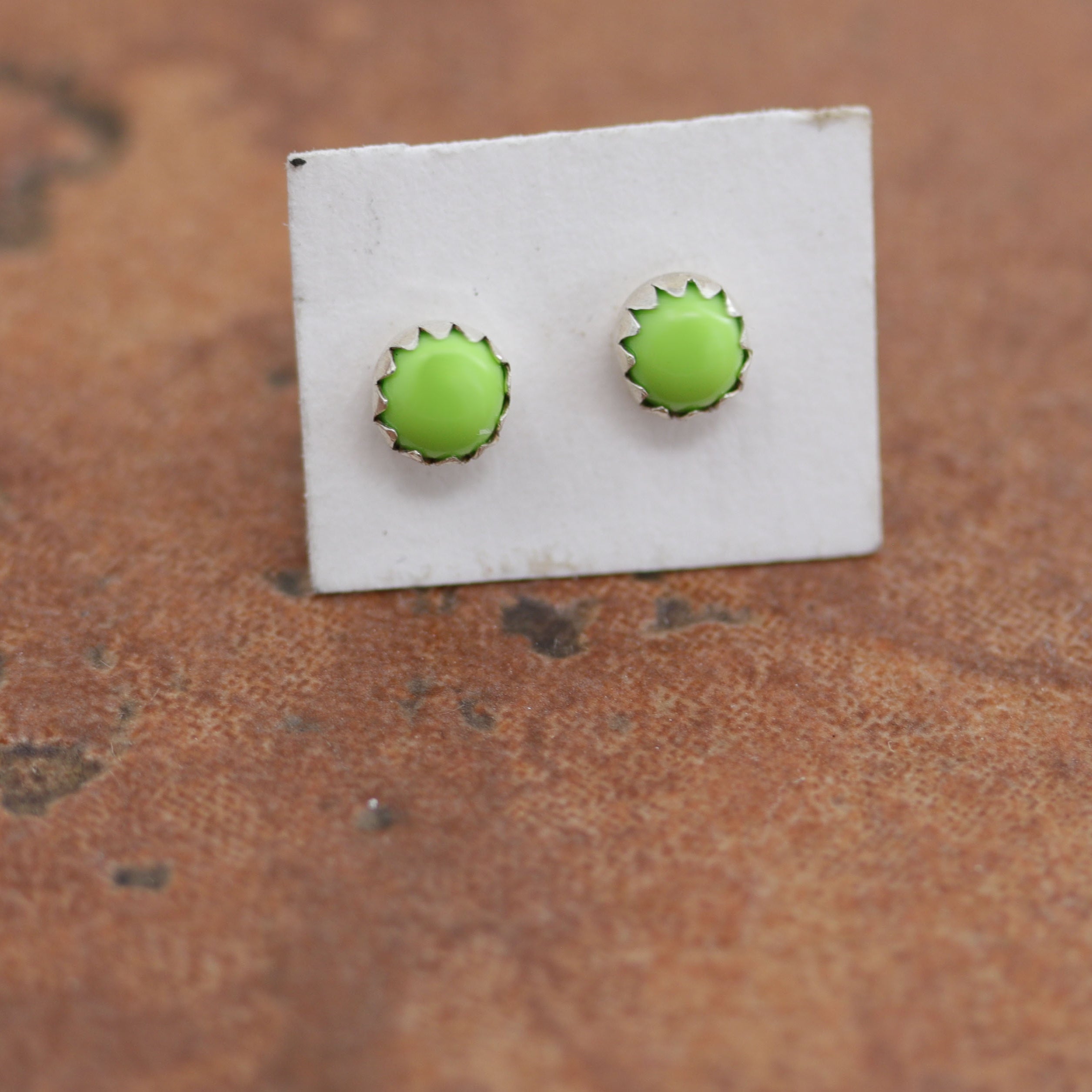 Wonderful Navajo earrings. They are made from sterling silver and gaspeite. The earrings are 3/16" in diameter.