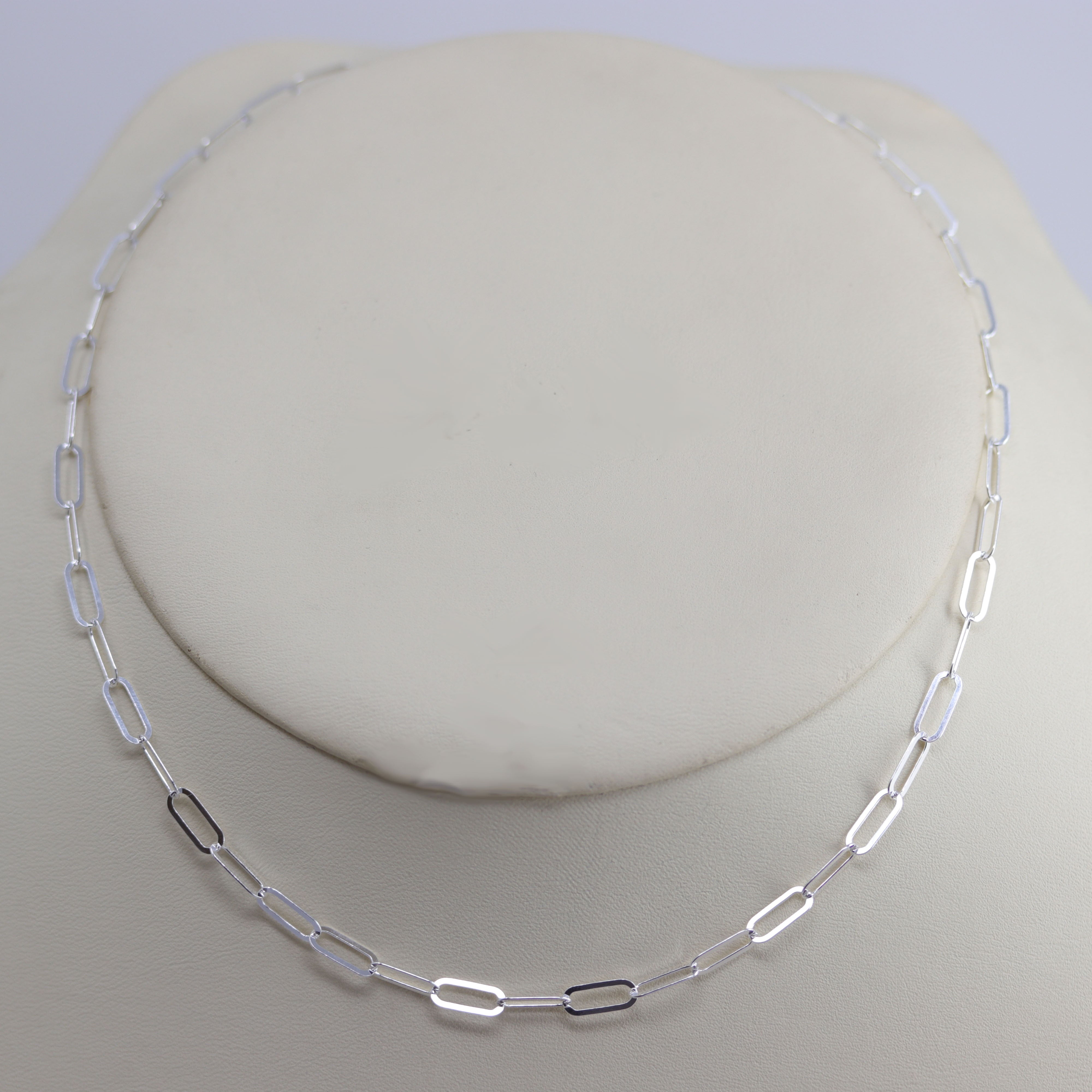 A Beautiful Paper Clip Chain Link Necklace. It is made from .925 sterling silver. The length is about 16" and the width is 3/16".