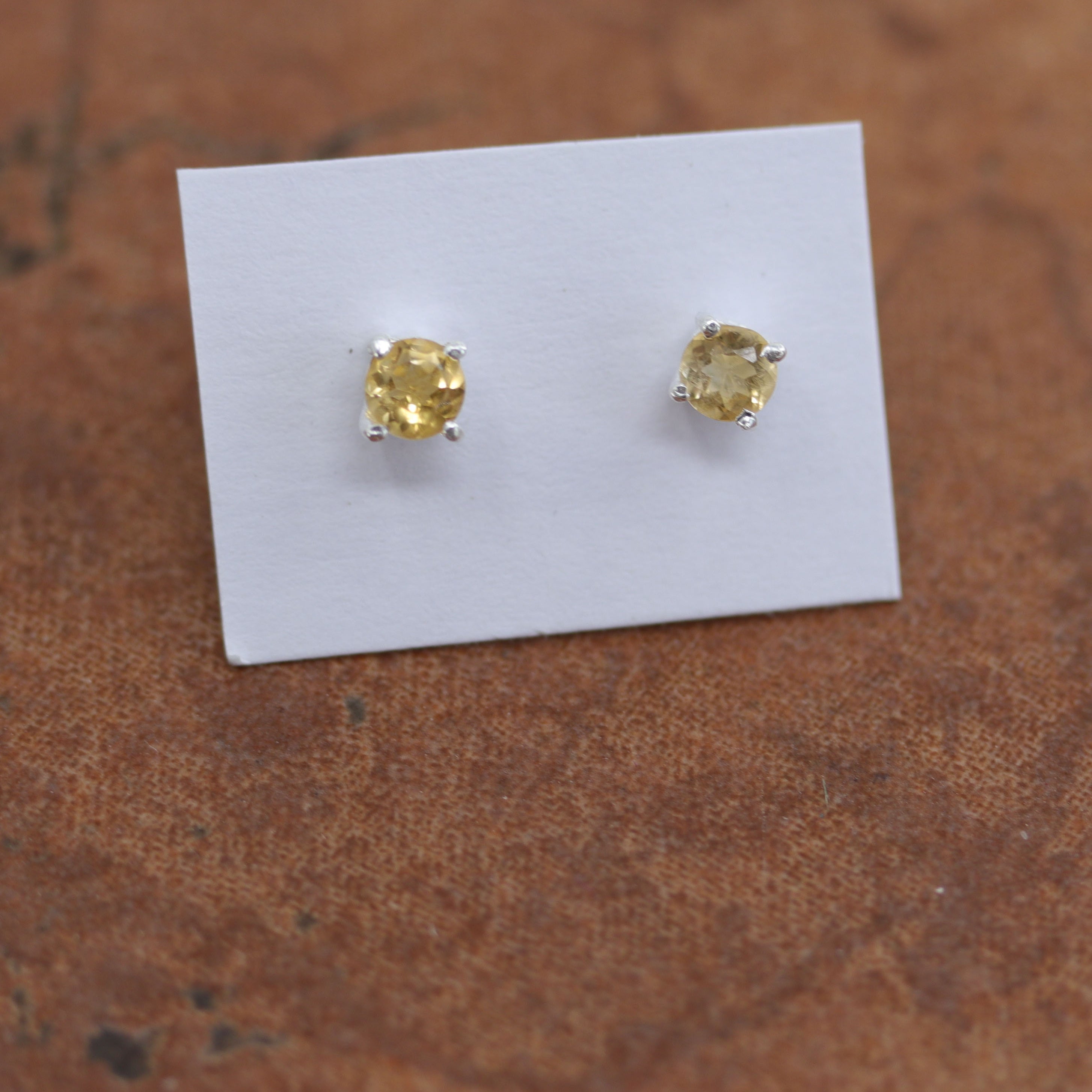 Beautiful gemstone earrings made from sterling silver and genuine citrine. The earrings are 3/16" in diameter.