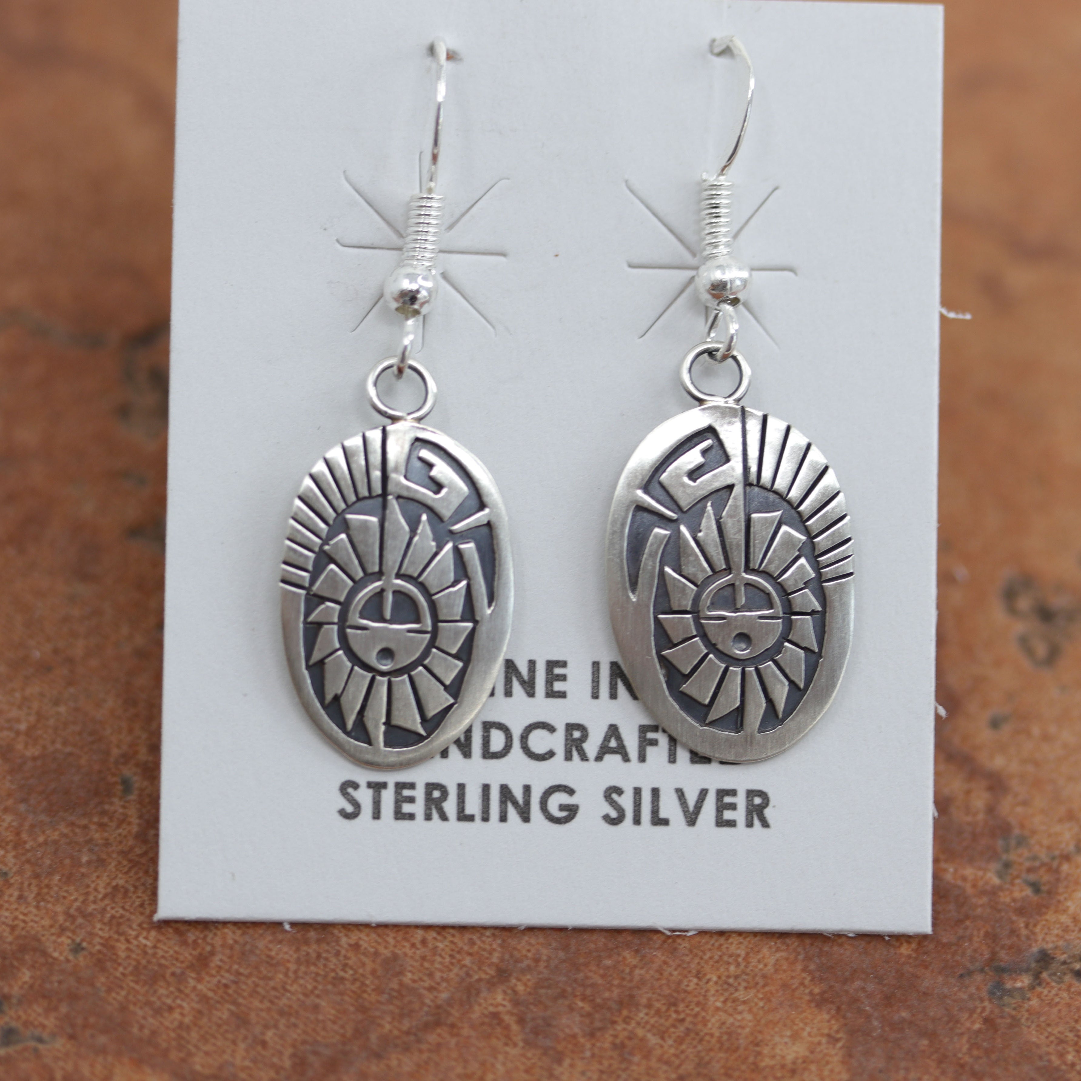 Beautiful Navajo earrings. They are made from sterling silver. Each earring is 1 3/4" in length including the hook and 5/8" in width.