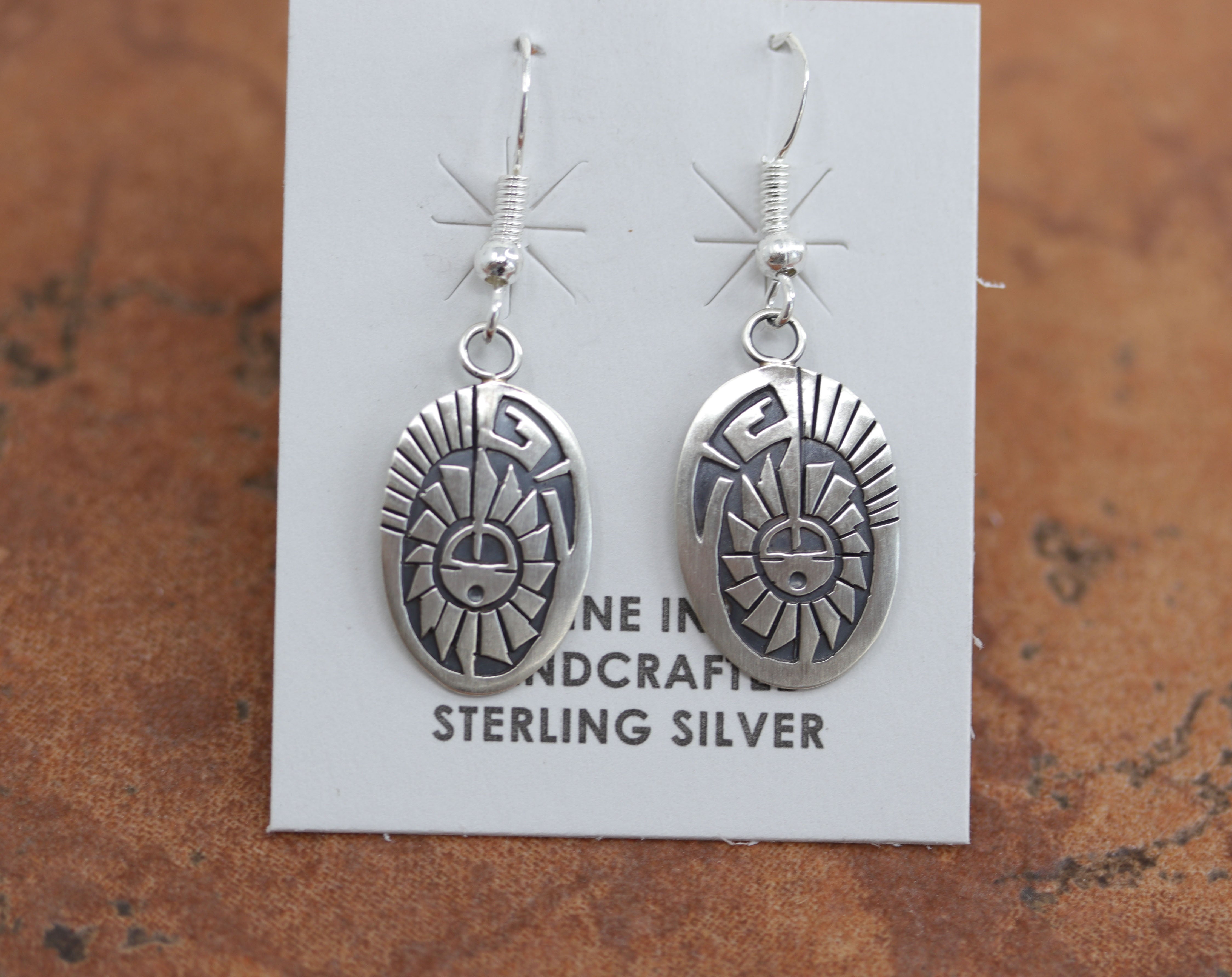 Beautiful Navajo earrings. They are made from sterling silver. Each earring is 1 3/4" in length including the hook and 5/8" in width.