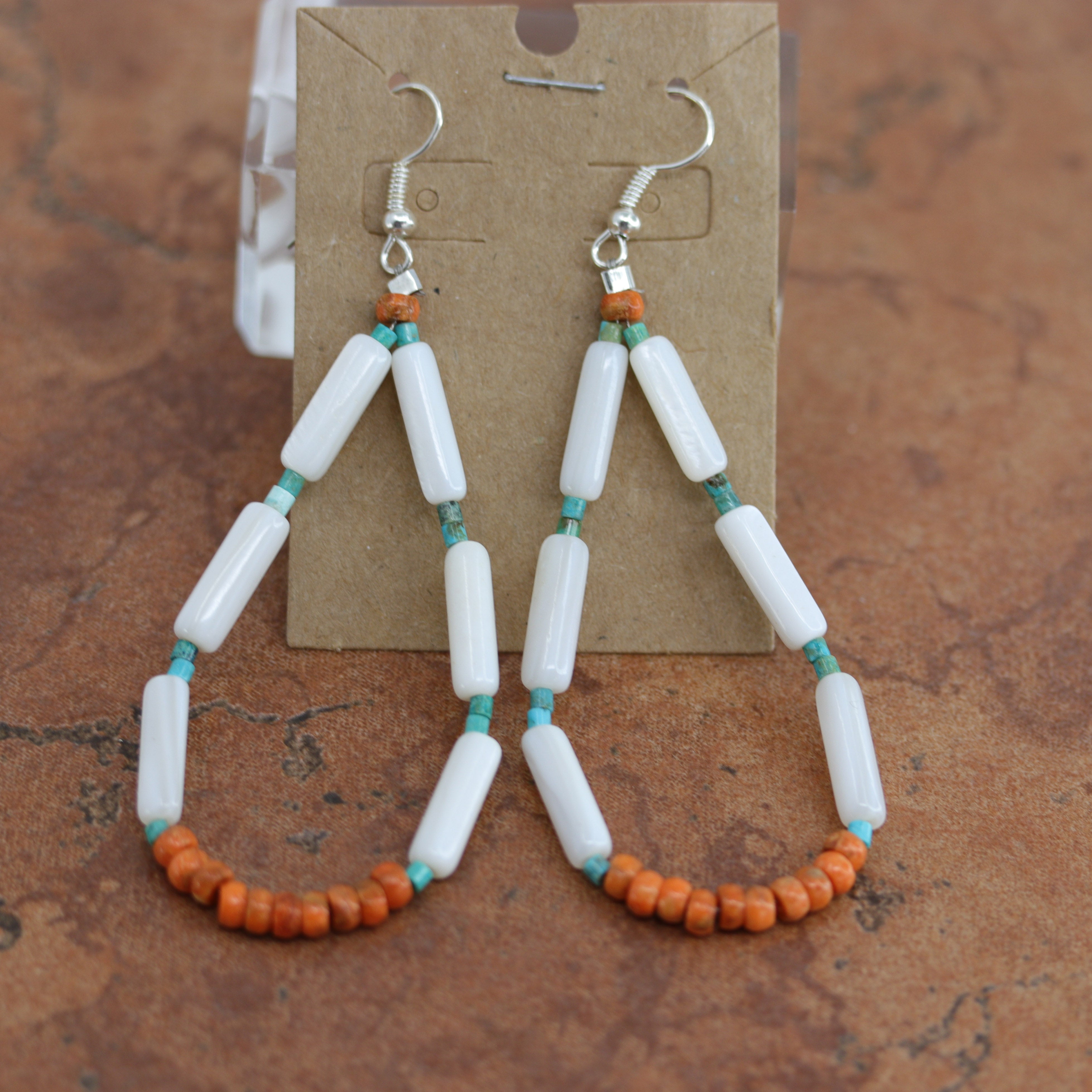 Beautiful Navajo Nugget Earrings. They are made from sterling silver and nuggets. The earrings about 3 1/4" long including the hook.
