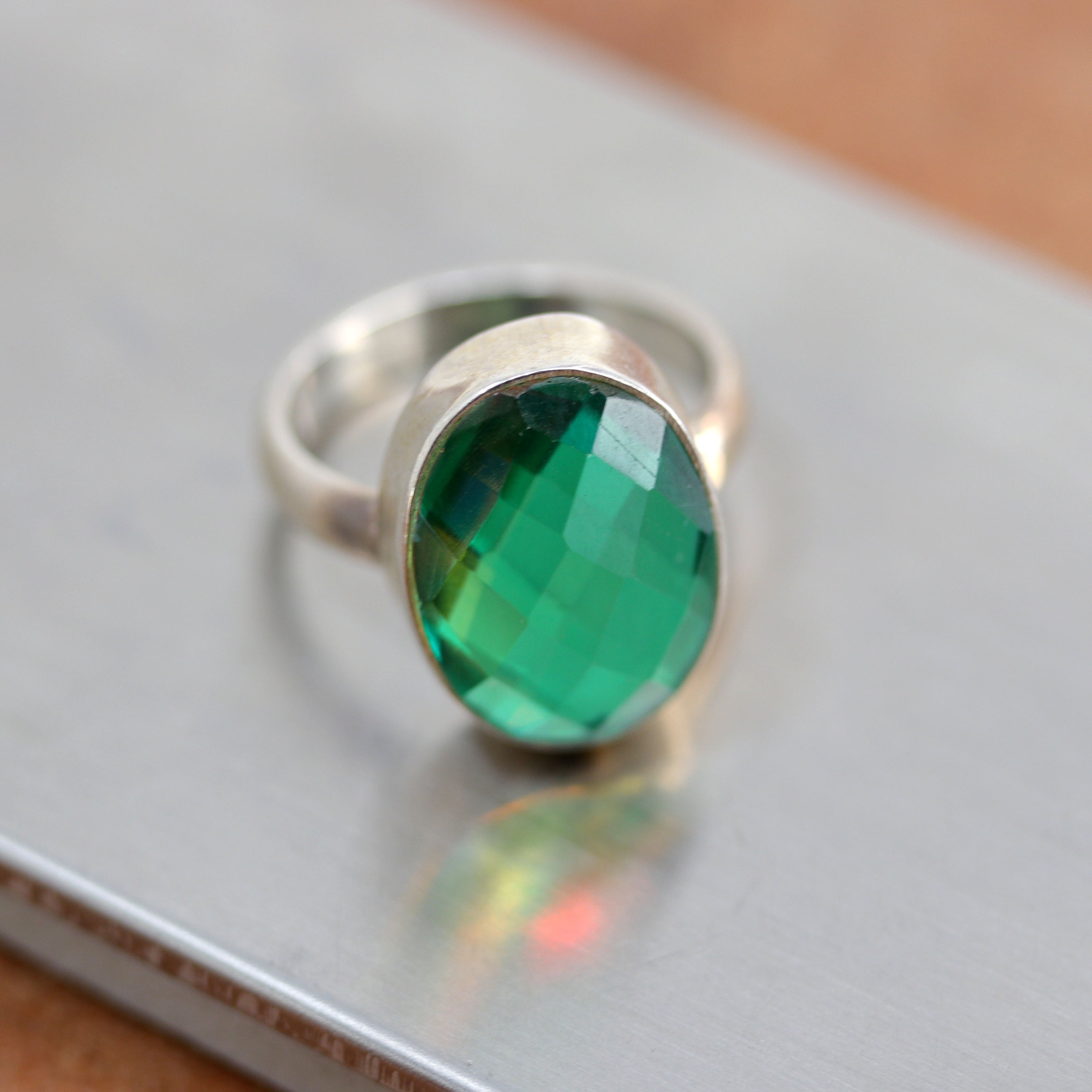 A beautiful Southwest Style gemstone ring made from sterling silver and mystic topaz. The ring size is 5 1/2 and it is about 3/4" in length.