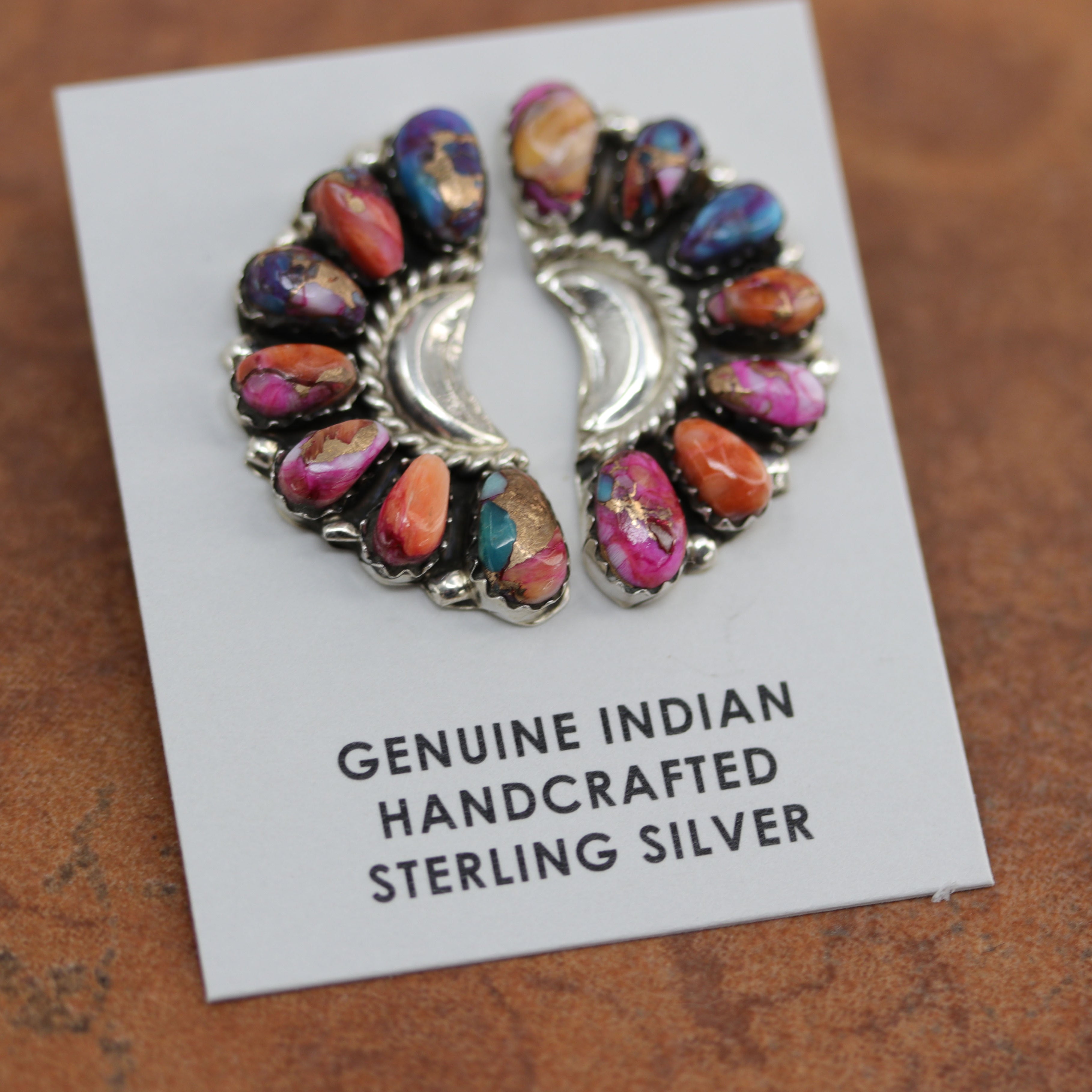 Authentic beautiful Navajo Native American cluster earrings. They are made from sterling silver and mojave turquoise. The earrings are about 1 1/4" in length and 5/8" in width. 