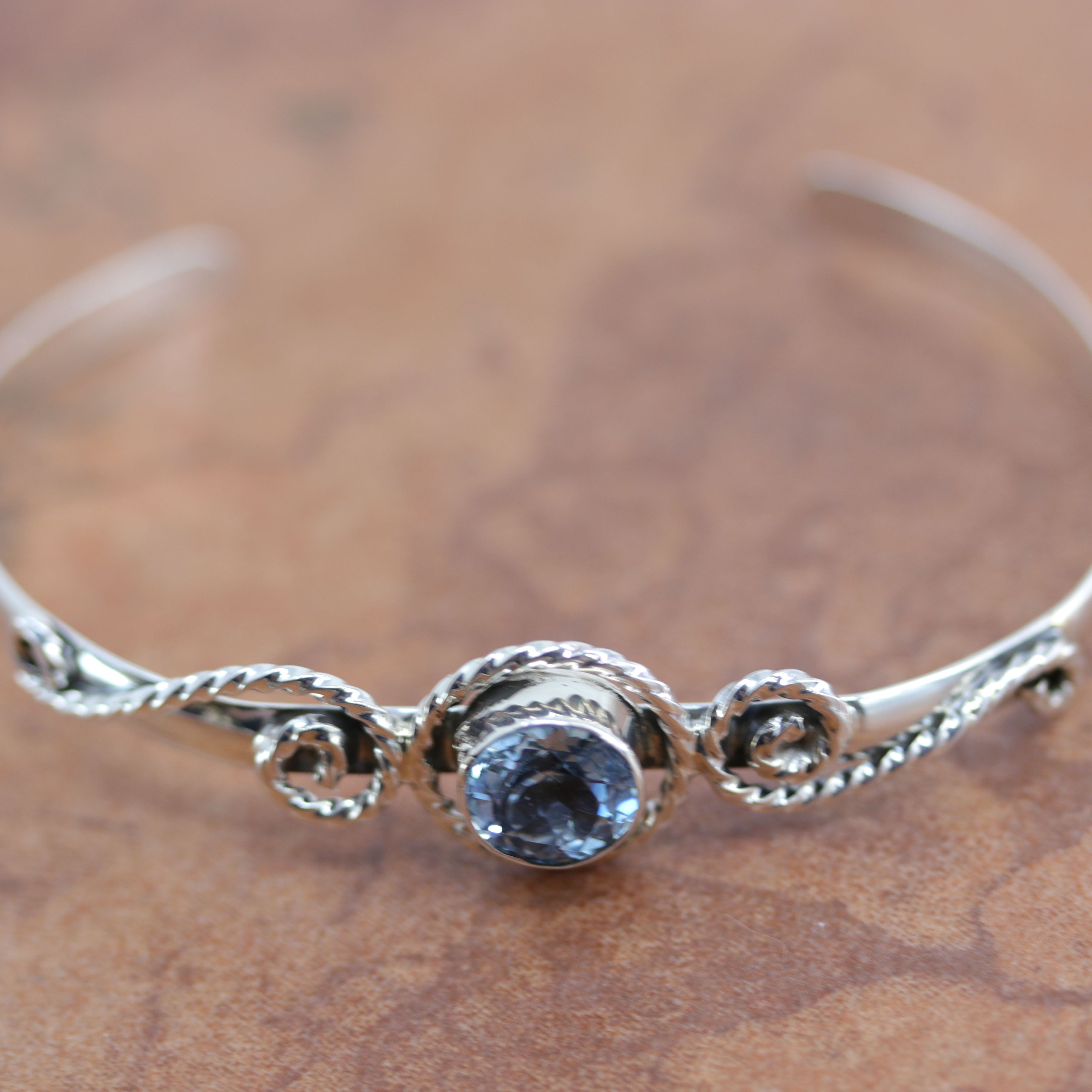 A Beautiful Navajo Native American bracelet. It is made from sterling silver and Aquamarine. It is about 6" around and about 5/8" wide at the widest point. The opening is about 1 1/4".