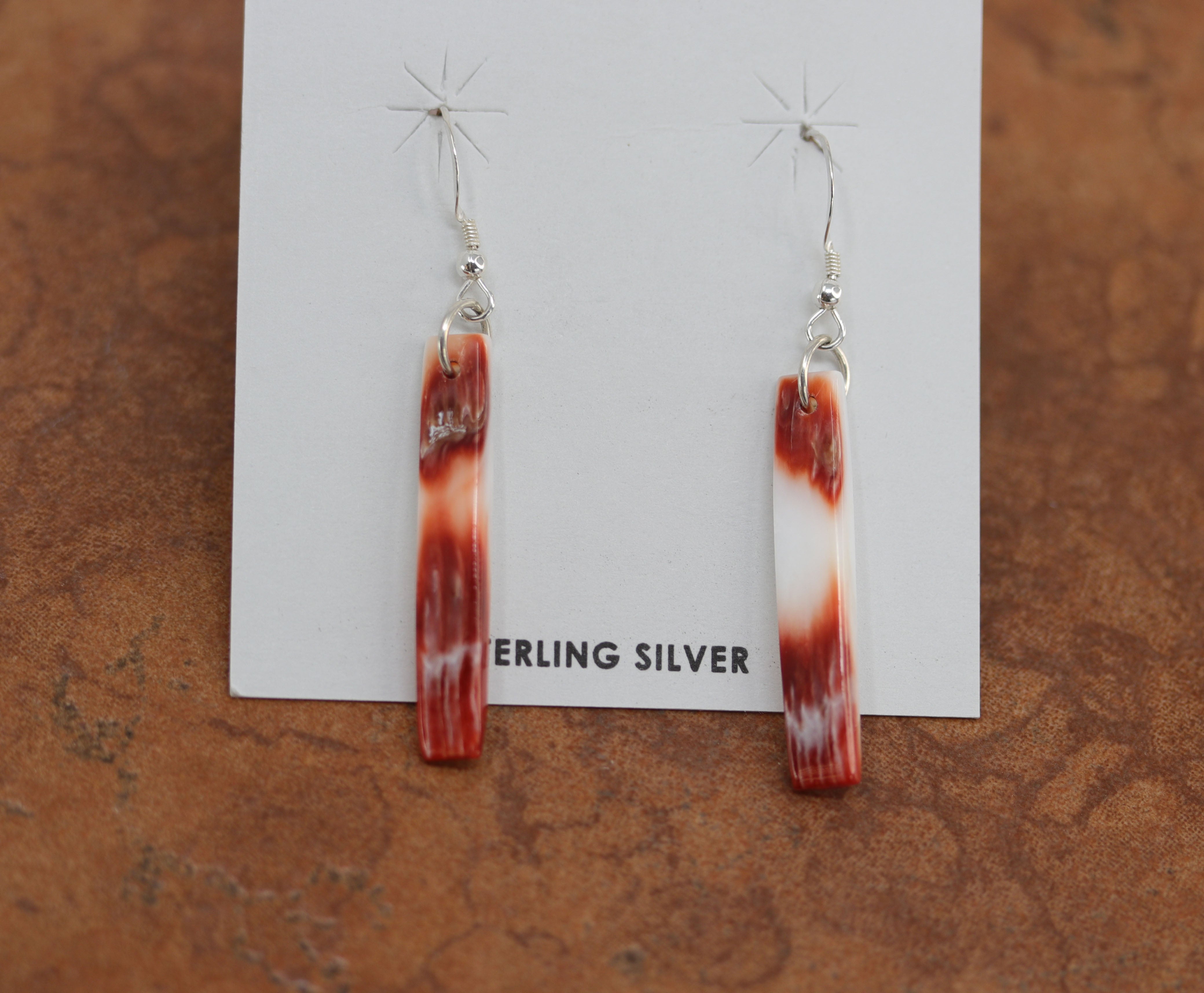 Gorgeous Navajo Native American earrings. They are made from sterling silver and spiny oyster. The earrings are about 2 1/8" in length, and 1/4" in width. 