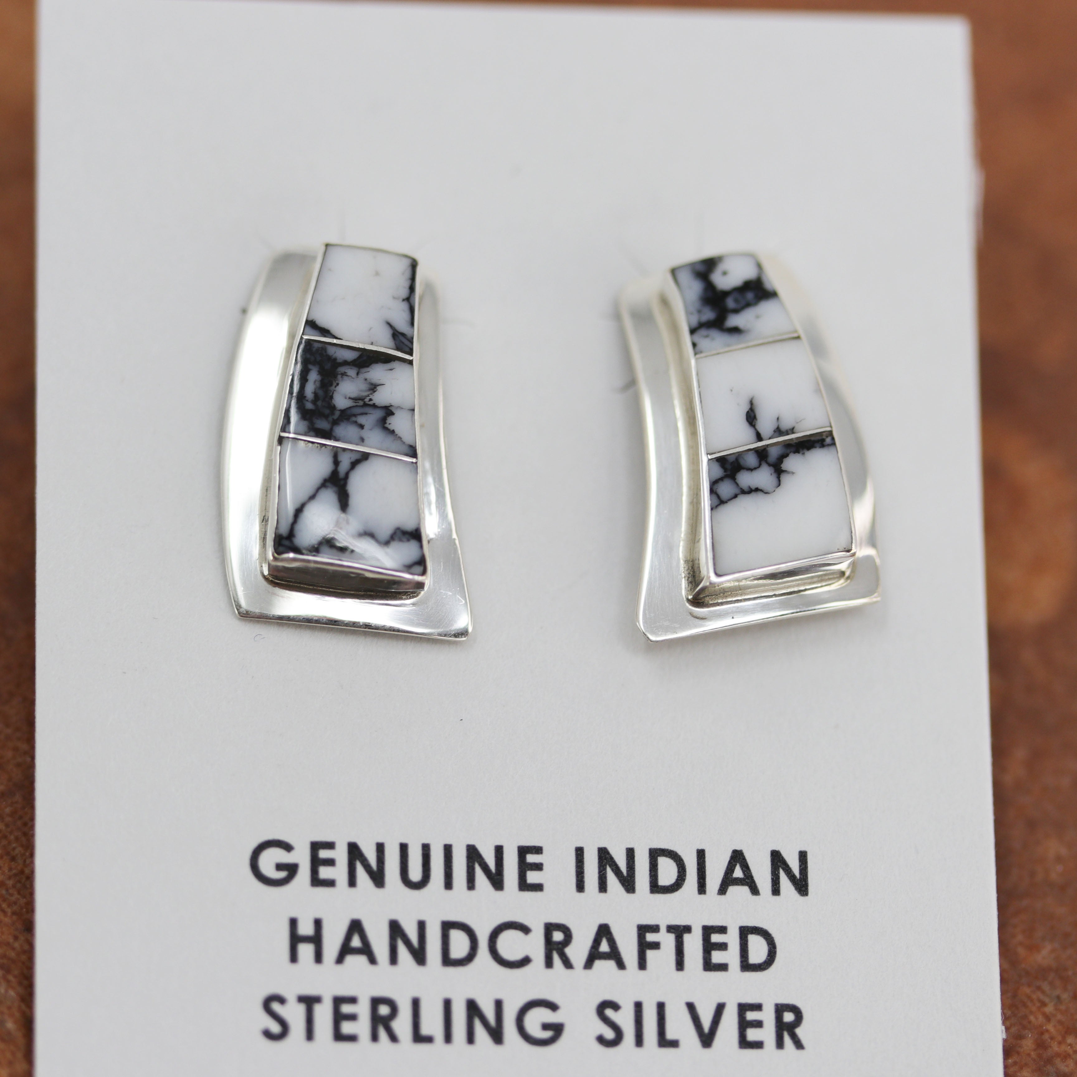 Beautiful earrings made from sterling silver and howlite. Each earring measures about 7/8" in length and 1/2" in width.