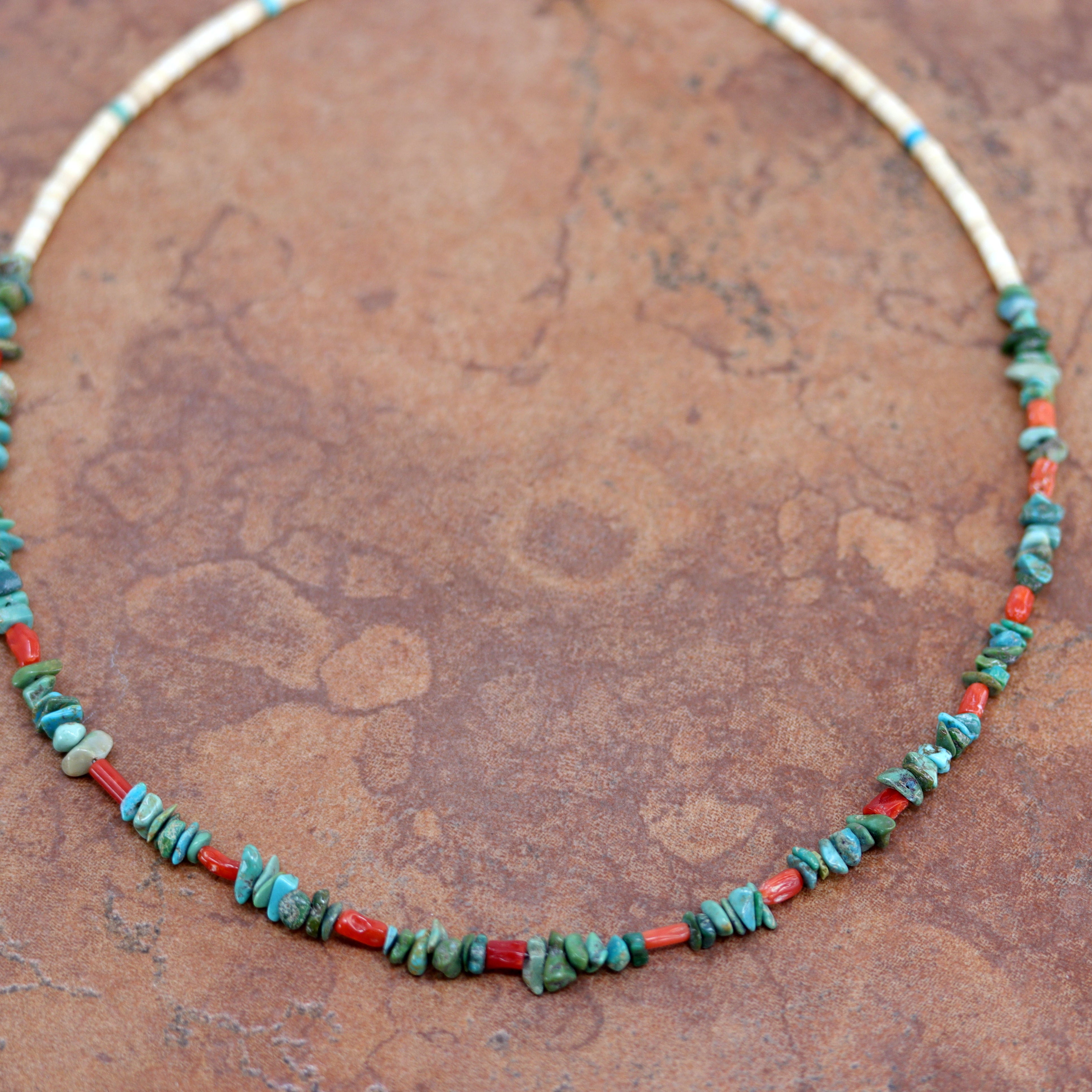 A Beautiful Navajo Native American necklace. The necklace is 18" in length and the larger pebbles measures 3/8".