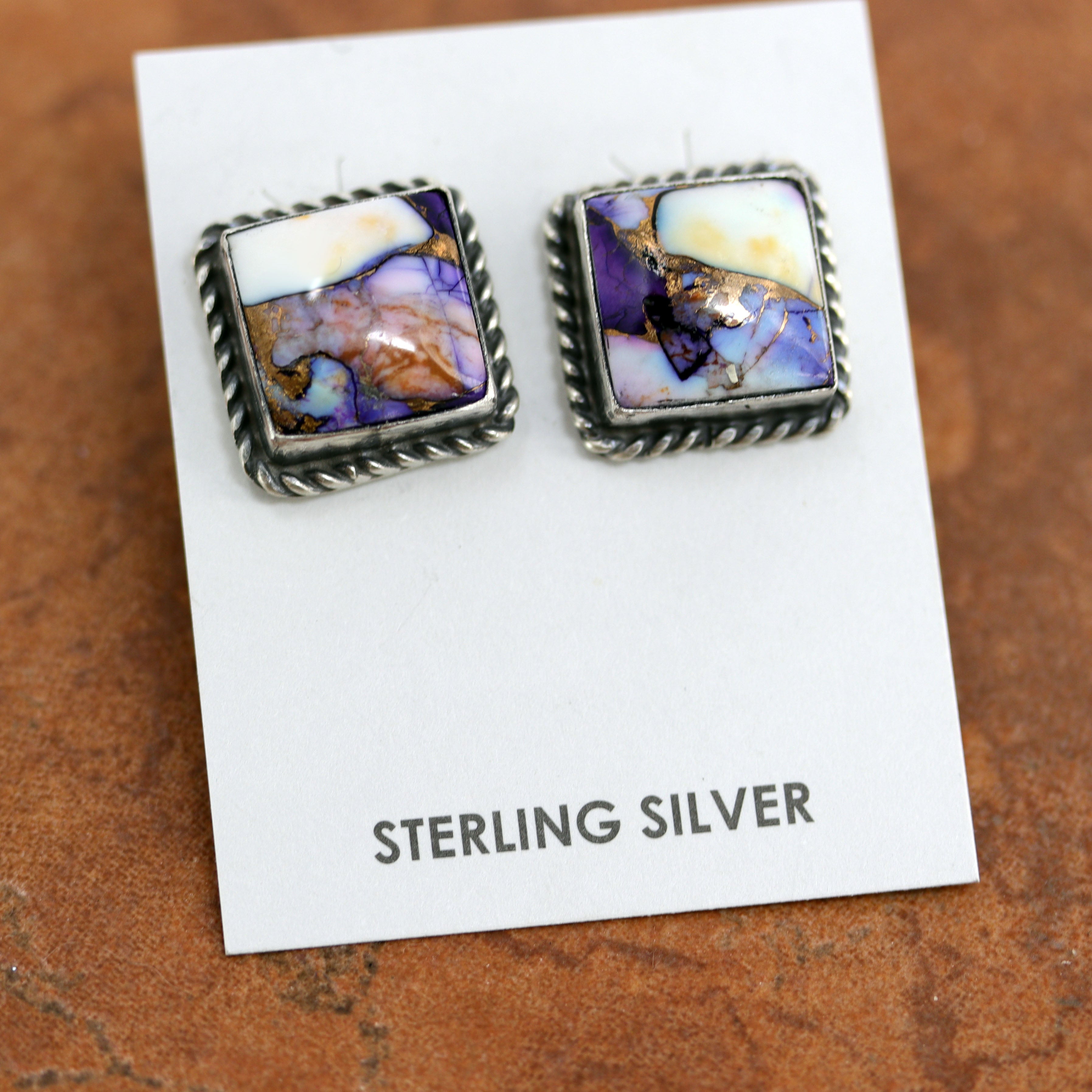 Navajo earrings by Freda Martinez. They are made from sterling silver and lavender dahlia turquoise. Each earring is 3/4" in length and 5/8" in width. 