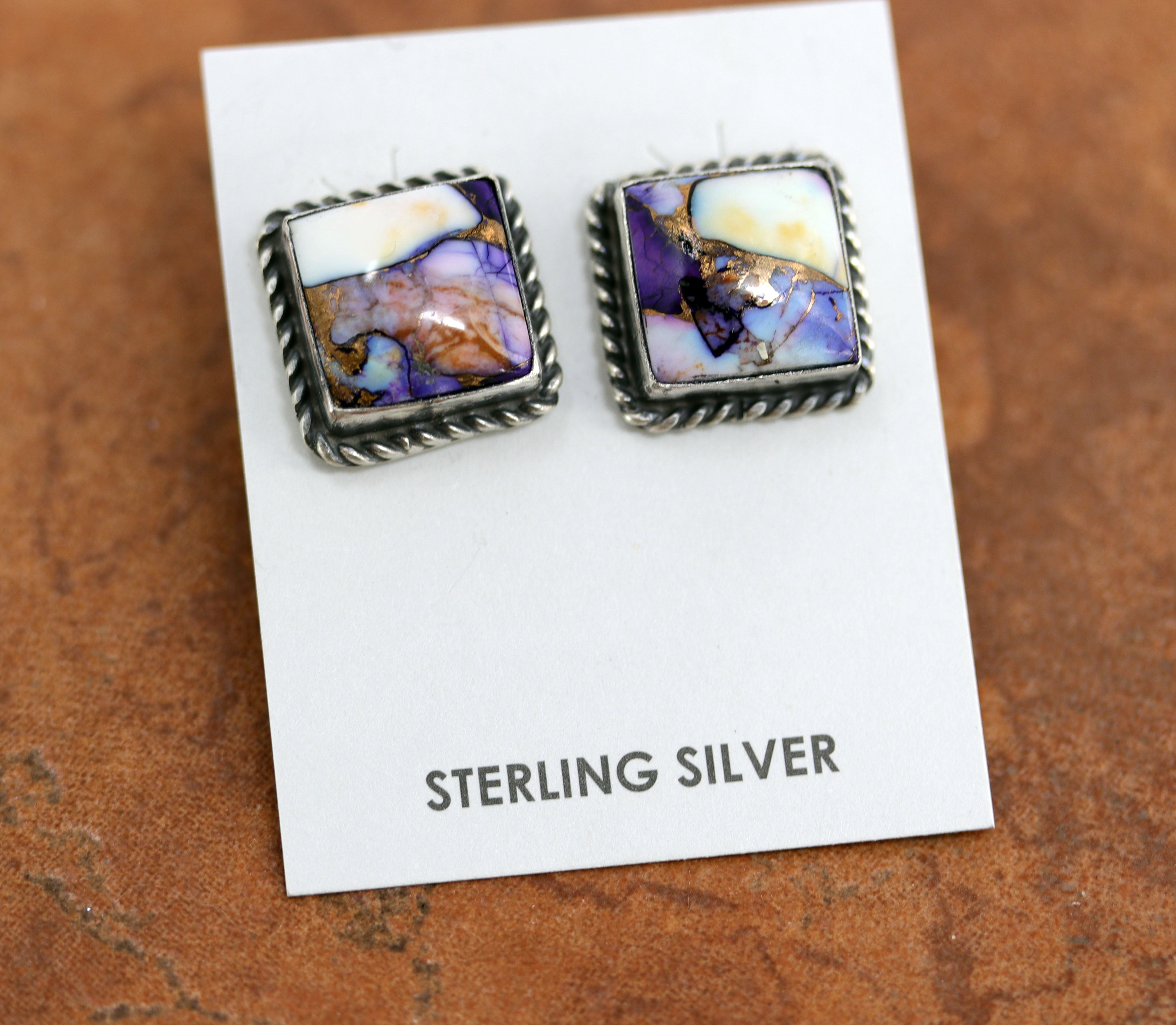 Navajo earrings by Freda Martinez. They are made from sterling silver and lavender dahlia turquoise. Each earring is 3/4" in length and 5/8" in width. 