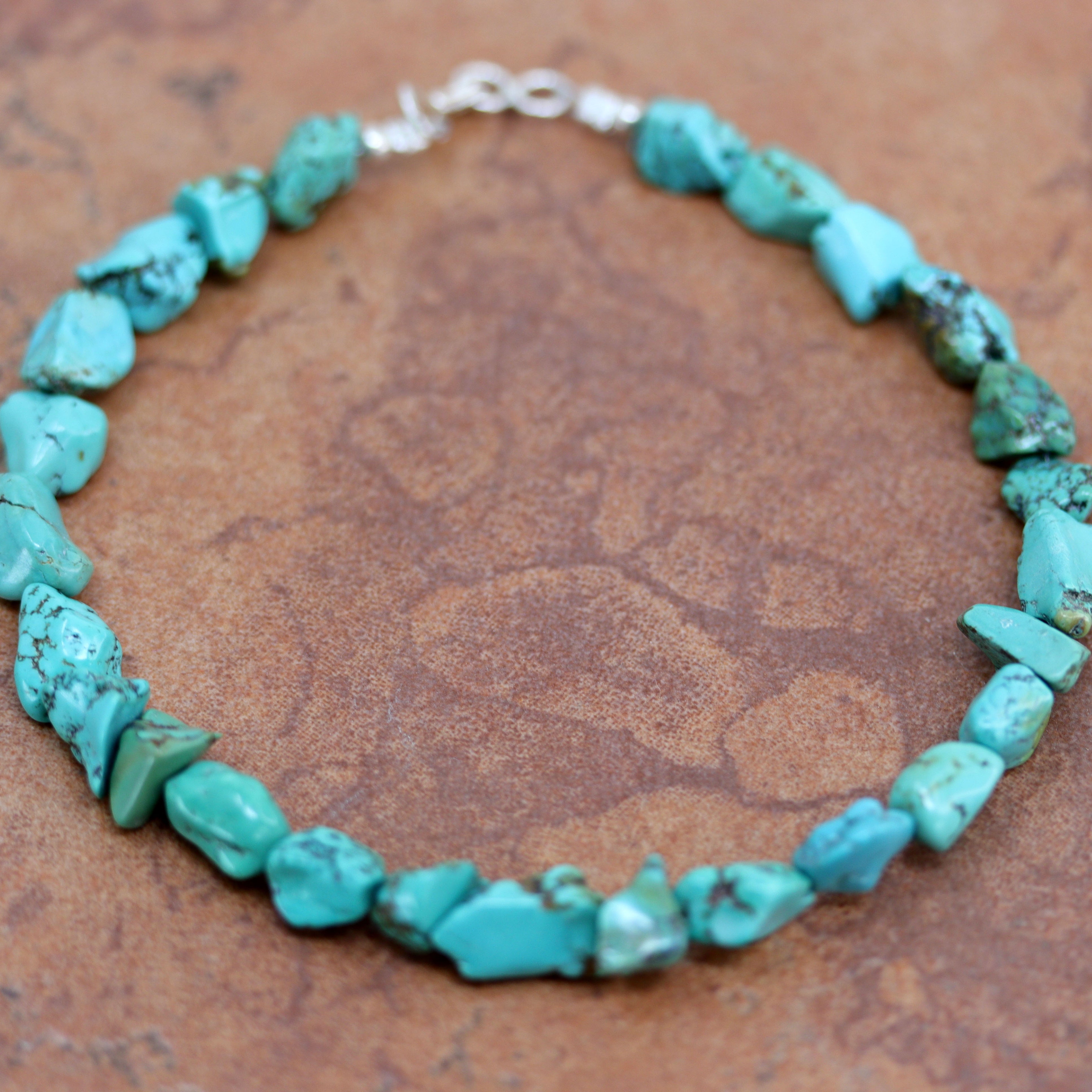 A beautiful beaded Navajo Native American Anklet. It is about 10" from end to end and the width is 1/2" at the widest point.