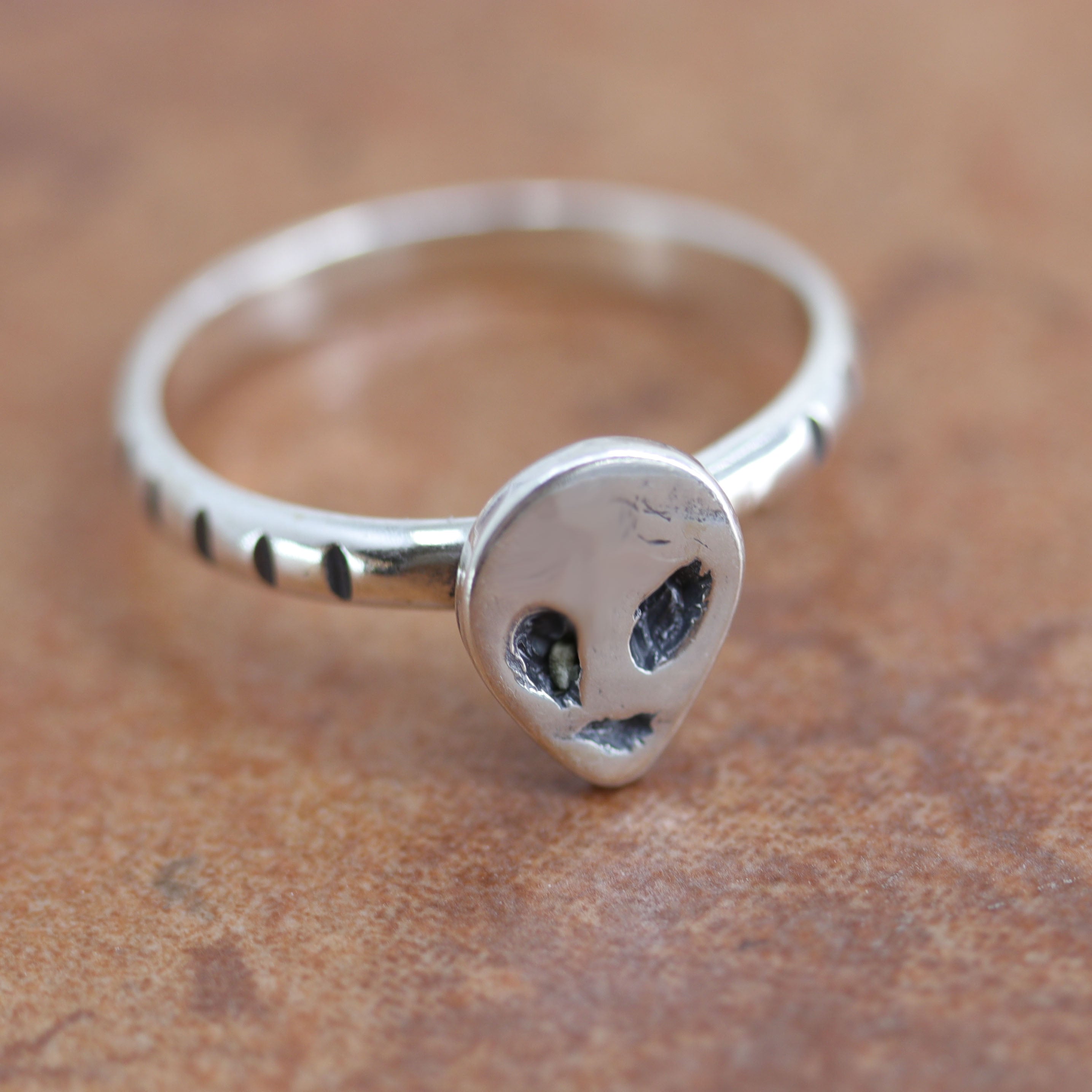 Navajo Native American ring. It is made from sterling silver. The ring size is 6 1/2 and it is 3/8" in length.