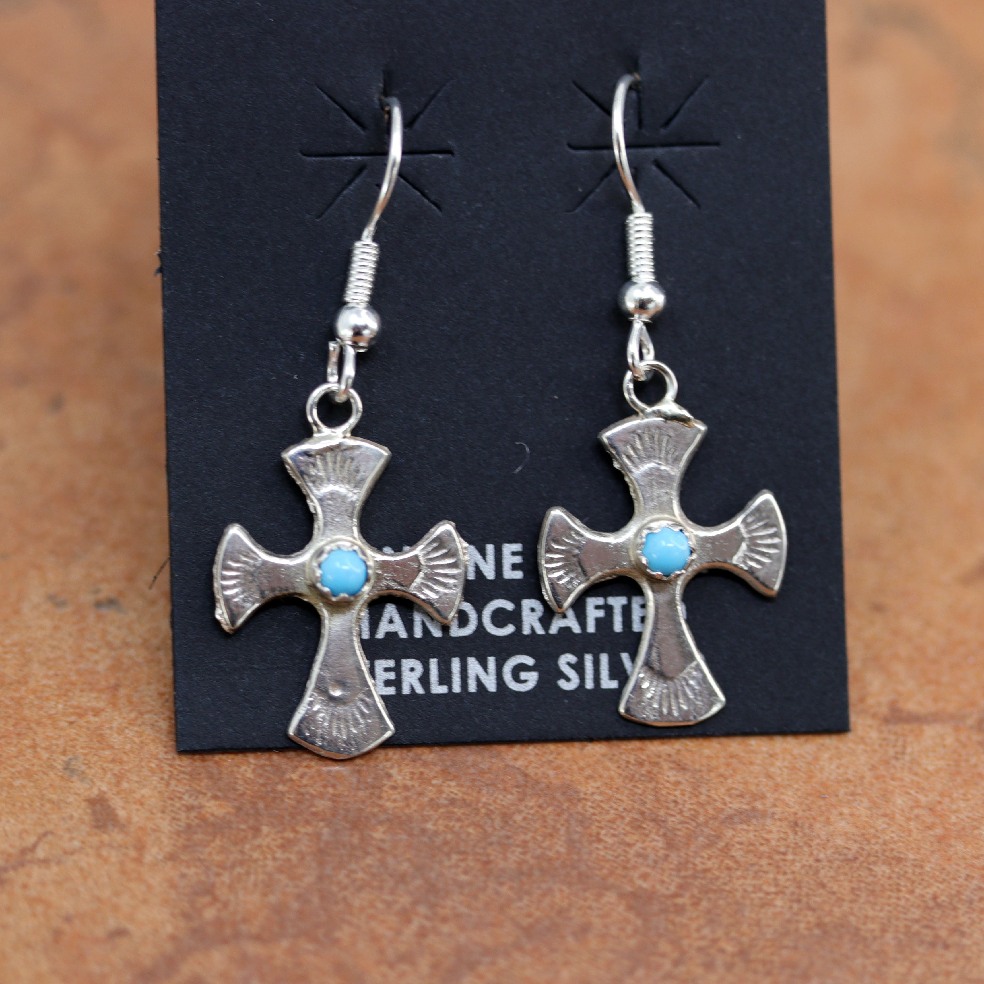 Beautiful Navajo Native American cross earrings. They are made from sterling silver and turquoise. The earrings are about 1 7/8" in length including the hook and 7/8" wide.