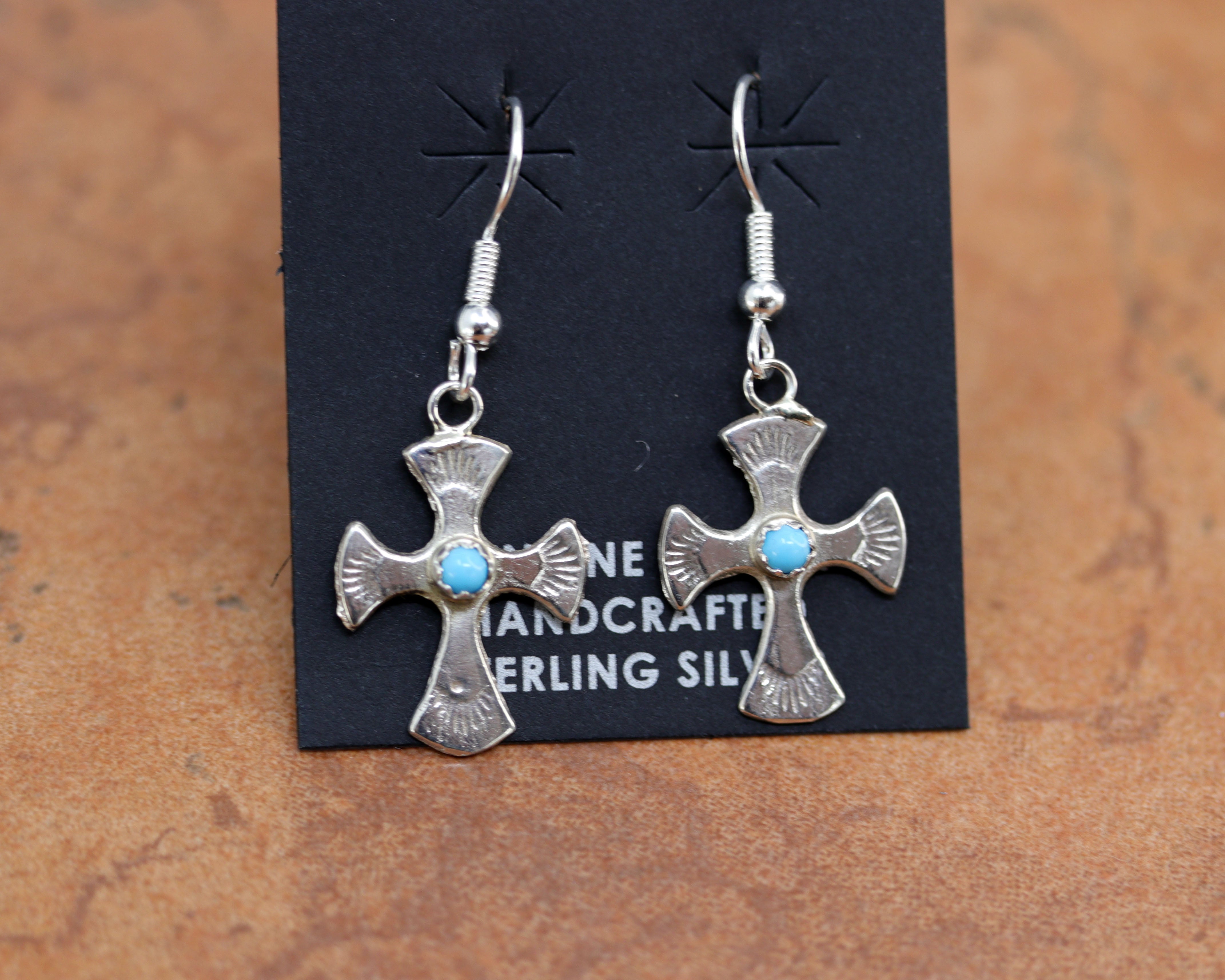 Beautiful Navajo Native American cross earrings. They are made from sterling silver and turquoise. The earrings are about 1 7/8" in length including the hook and 7/8" wide.
