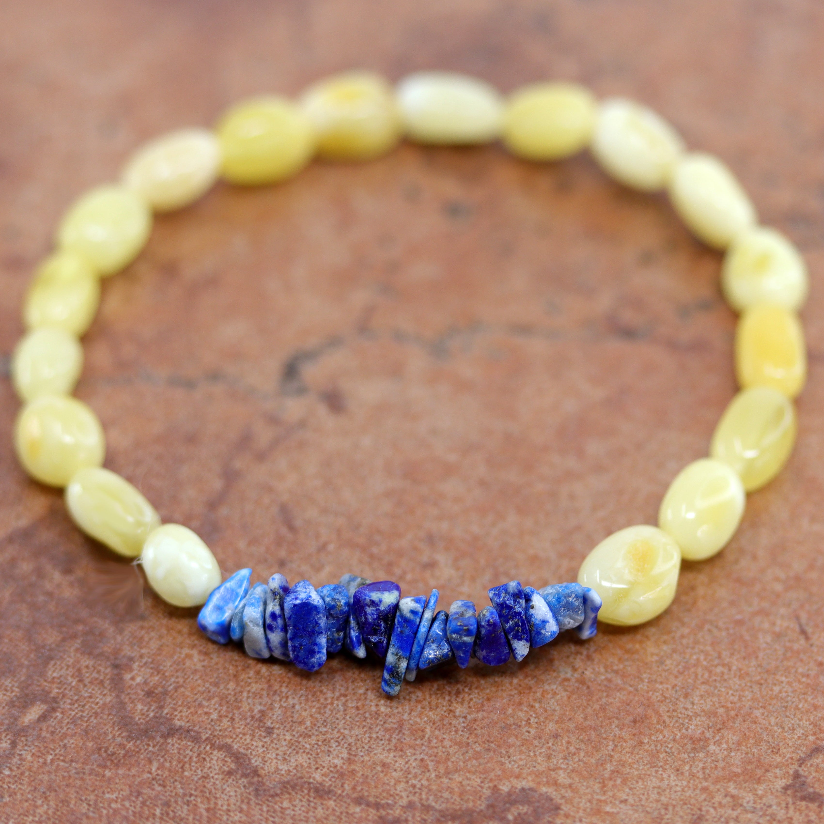 The amber comes from the Baltic Sea. It also has denim lapis nuggets. It fits sizes 6" (more loose) to about 7" (tighter fit). The width is 3/8".