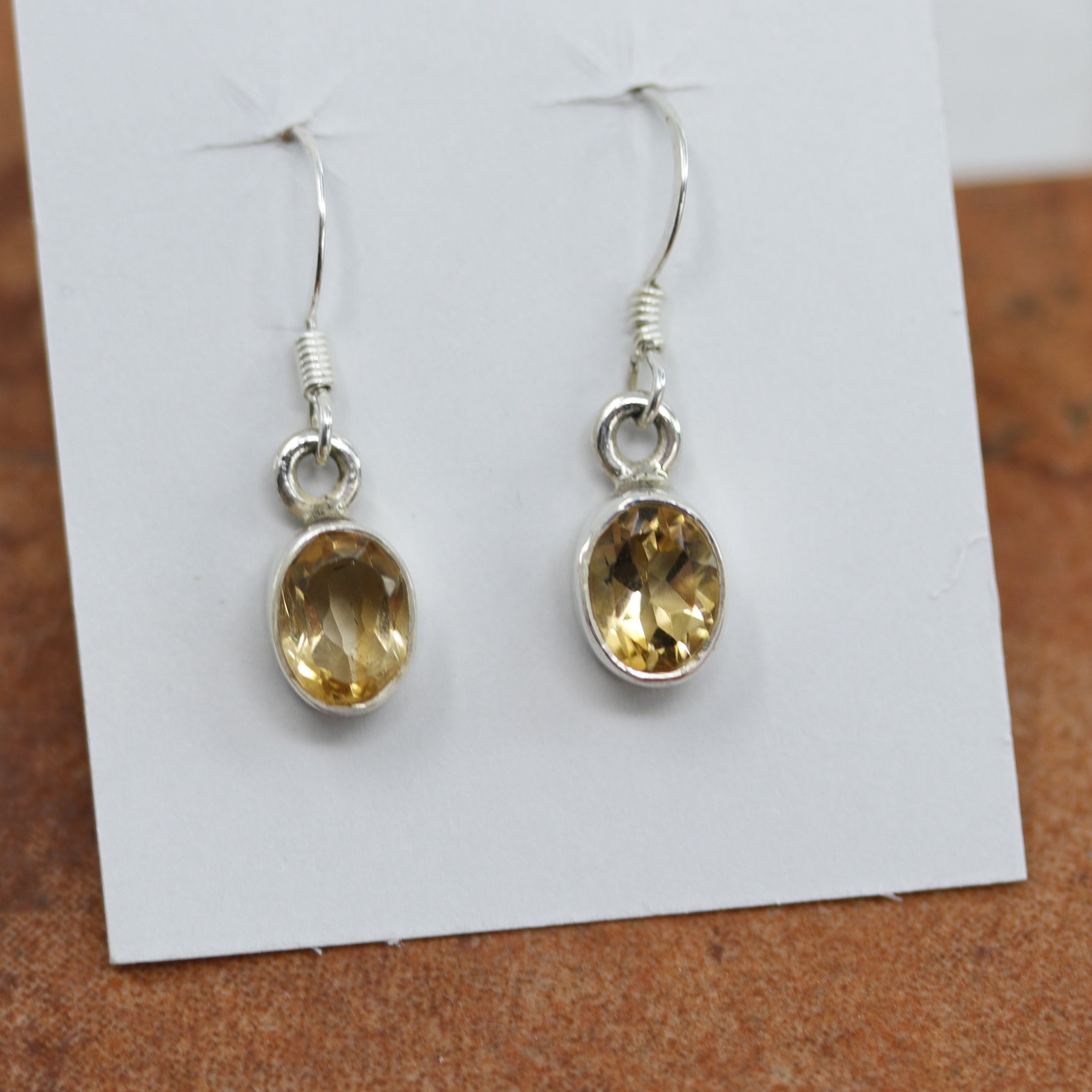 Beautiful earrings made from sterling silver and citrine . The earrings are about 1 1/4" in length including the hook and 3/8" in width.
