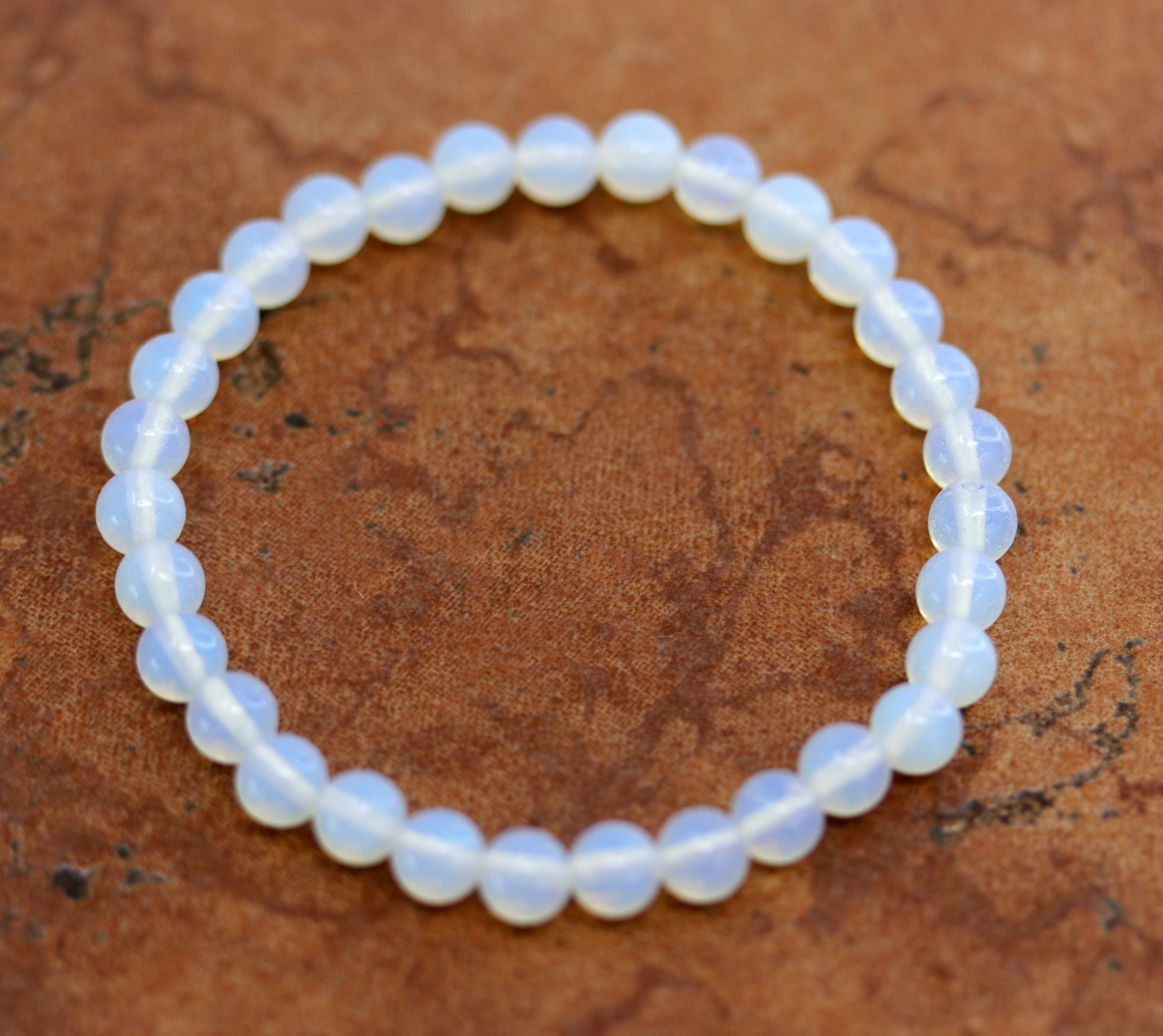 A beautiful opalite bubble bracelet. It fits sizes 6" (more loose) to about 9" (tighter fit). The width of the bracelet is 6 mm.