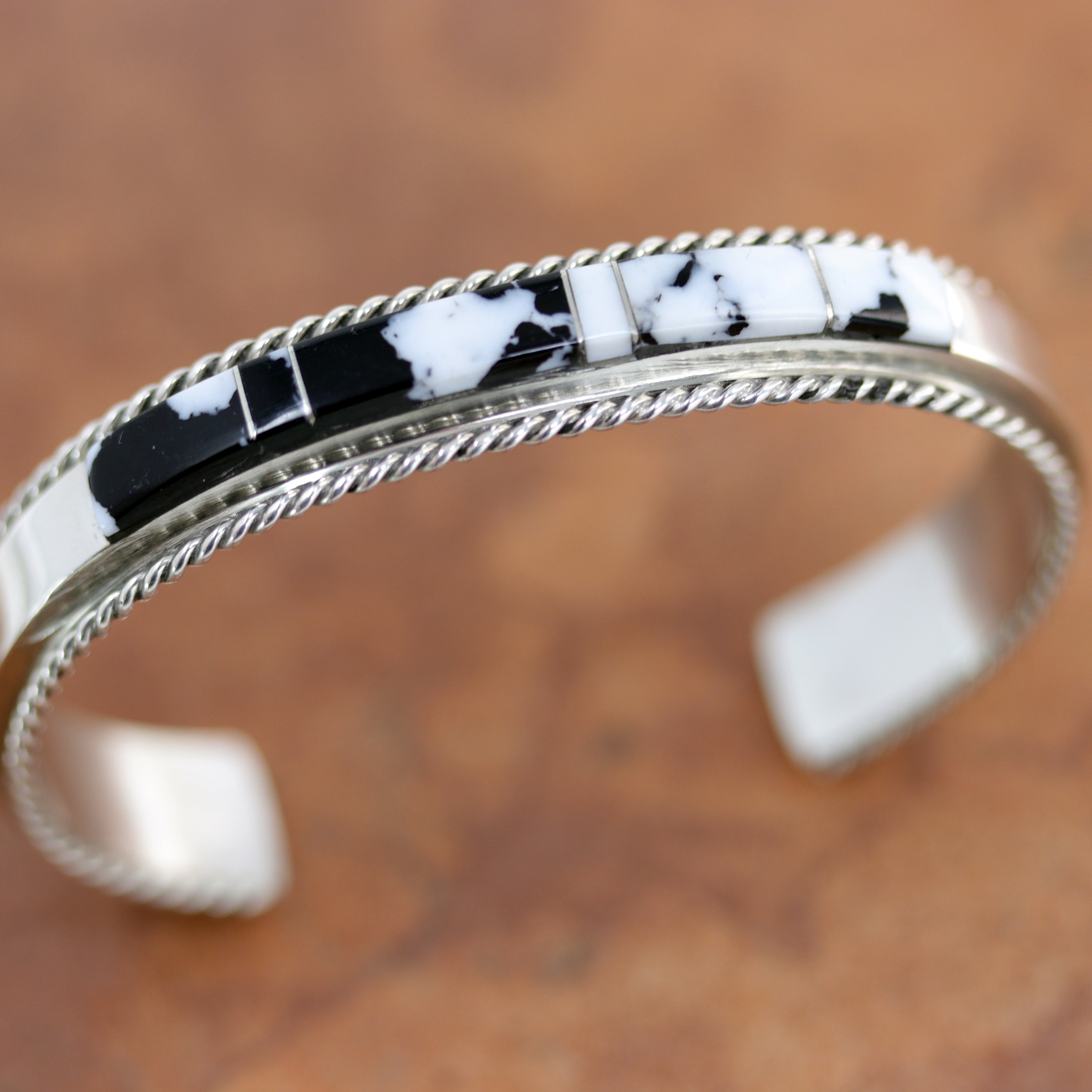 Silver Bracelet with and black stones made from white buffalo